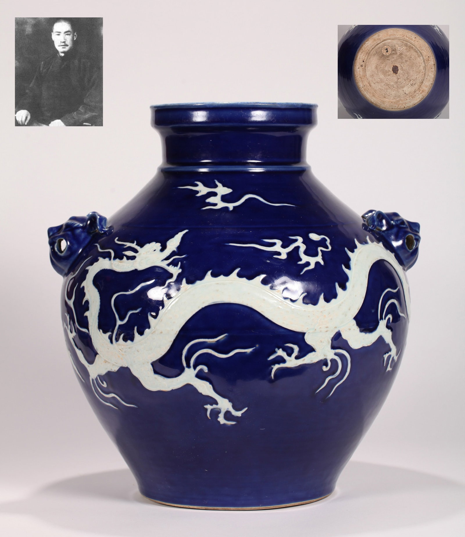 A BLUE-GLAZED JAR: A blue-glazed jar with double mask handles, decorated with reserved white design. Height 35.5 cm. Note: By repute, from the collection of Ma Bufang. As the document lists multiple items, only a copy i