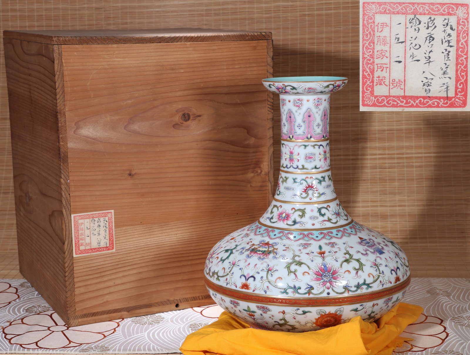 A YANGCAI VASE: A Yangcai vase (Biqi Ping) decorated with lotus and Eight Buddhist Emblems. Height 33 cm.