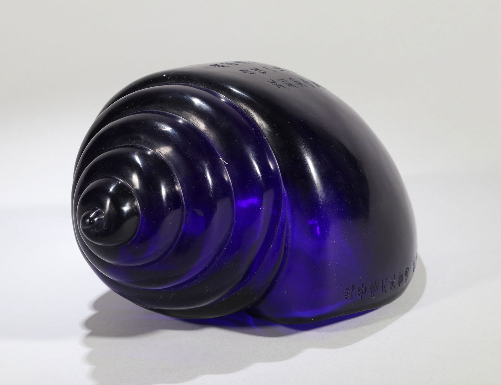 A BLUE GLASS CONCH SHELL - 9