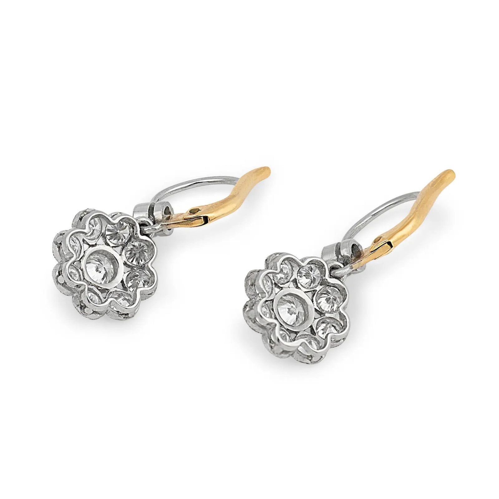 PAIR OF DIAMOND CLUSTER DROP EARRINGS IN TWO-TONE GOLD: Each earring is composed of a suspended floral-style cluster, centered by a larger diamond encircled by smaller diamonds arranged in a symmetrical rosette. The fittings are executed in yellow gold, pr