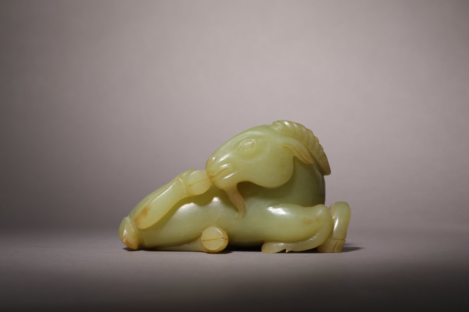 A YELLOWISH JADE 'RAM' ORNAMENT (1 of 5)