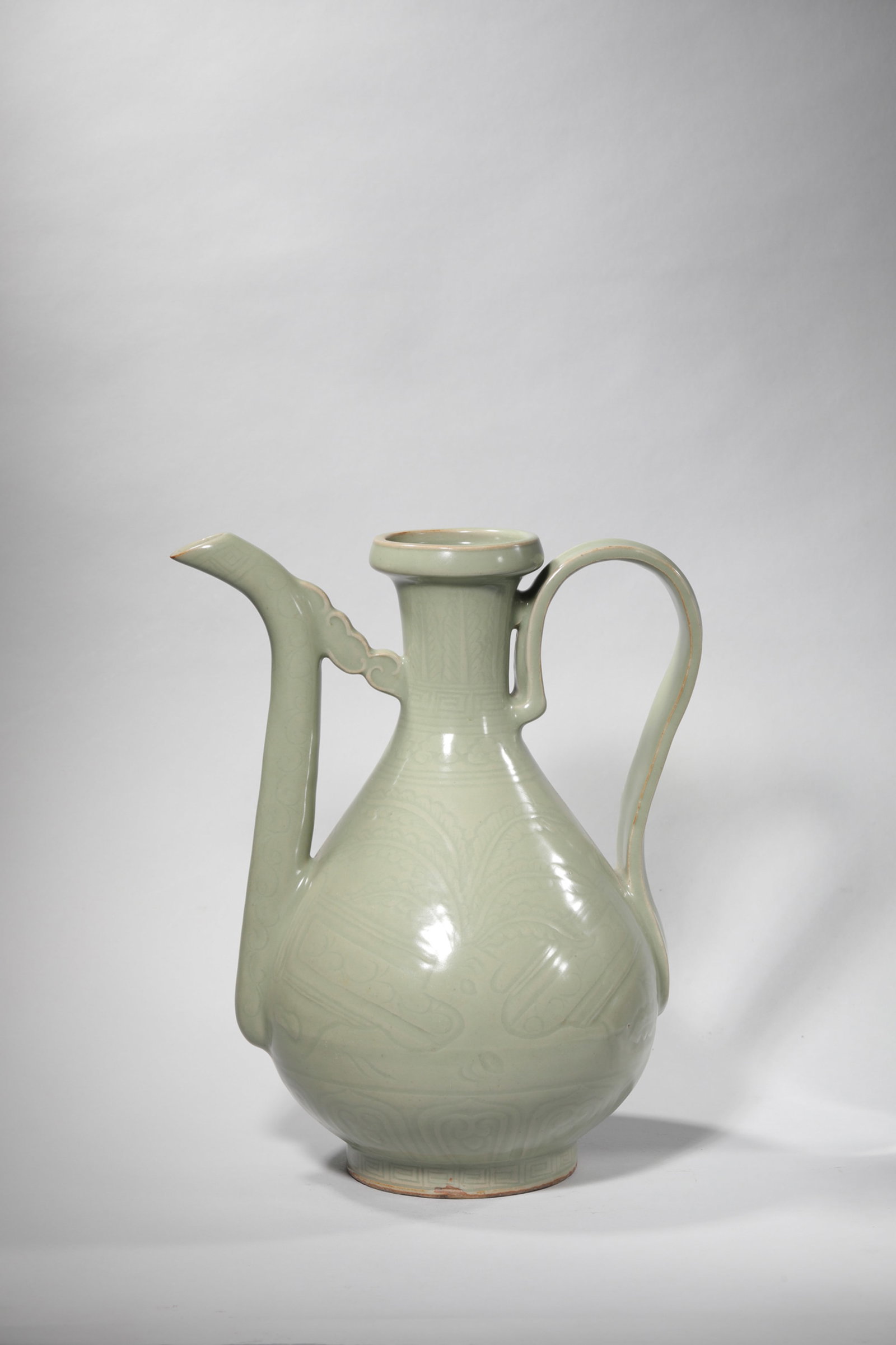 AN INCISED CELADON-GLAZED EWER (1 of 7)