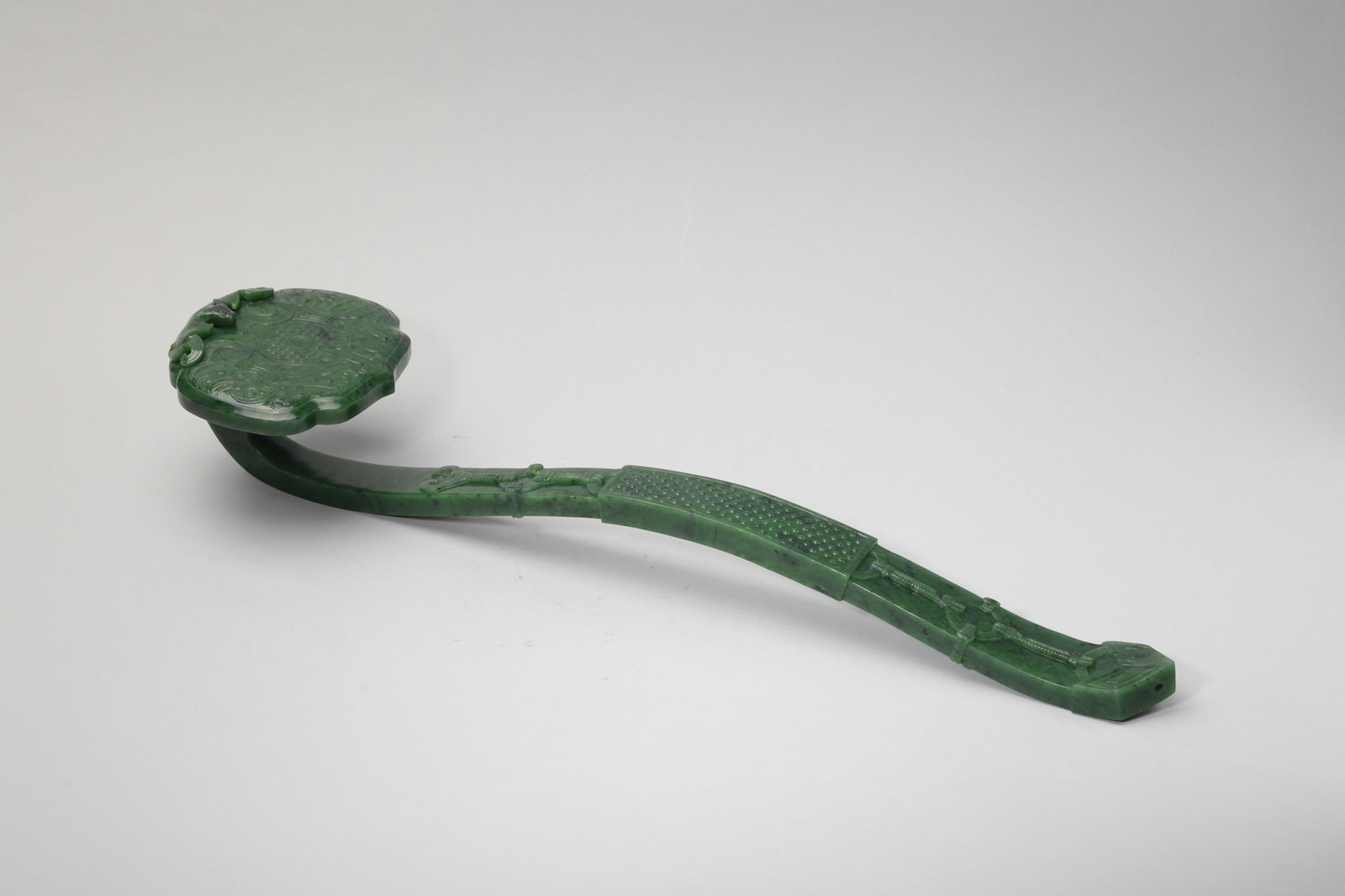 A SPINACH-GREEN JADE RUYI SCEPTER (1 of 5)