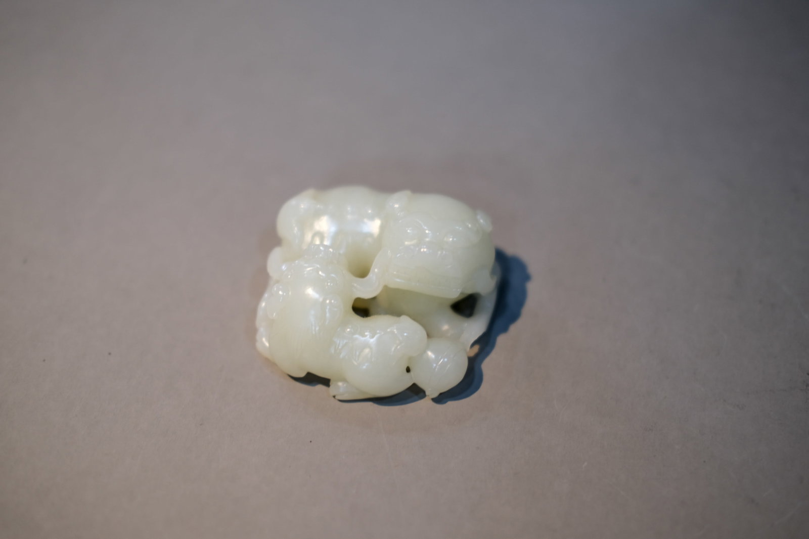 A WHITE JADE 'TWIN-LION' ORNAMENT (1 of 3)