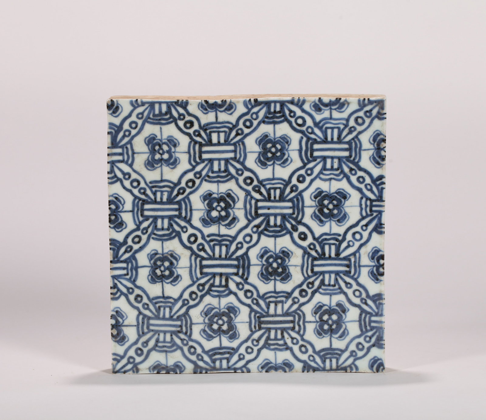 A BLUE AND WHITE TILE - 2