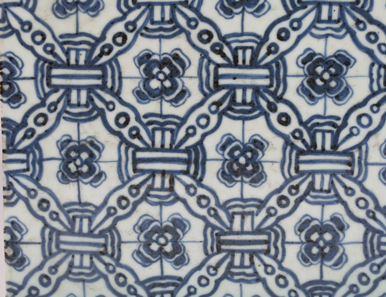 A BLUE AND WHITE TILE - 4