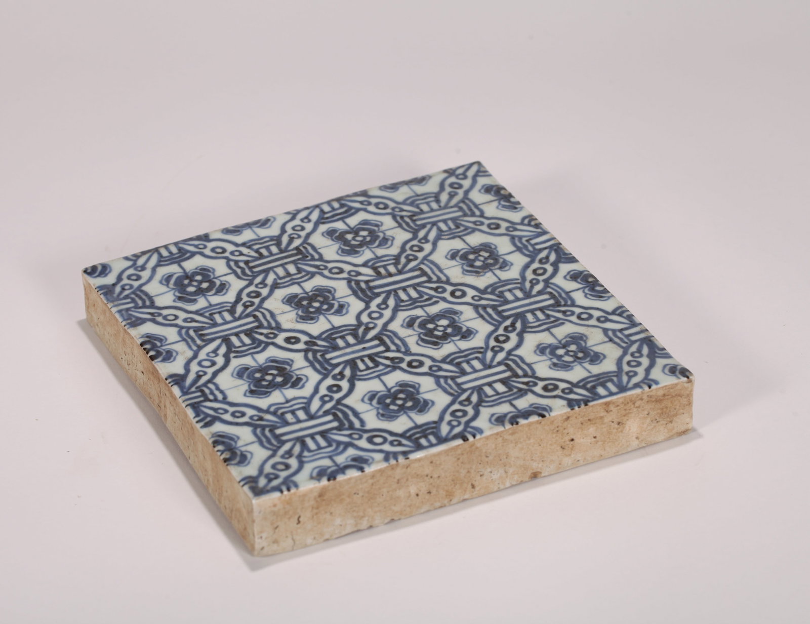 A BLUE AND WHITE TILE - 8