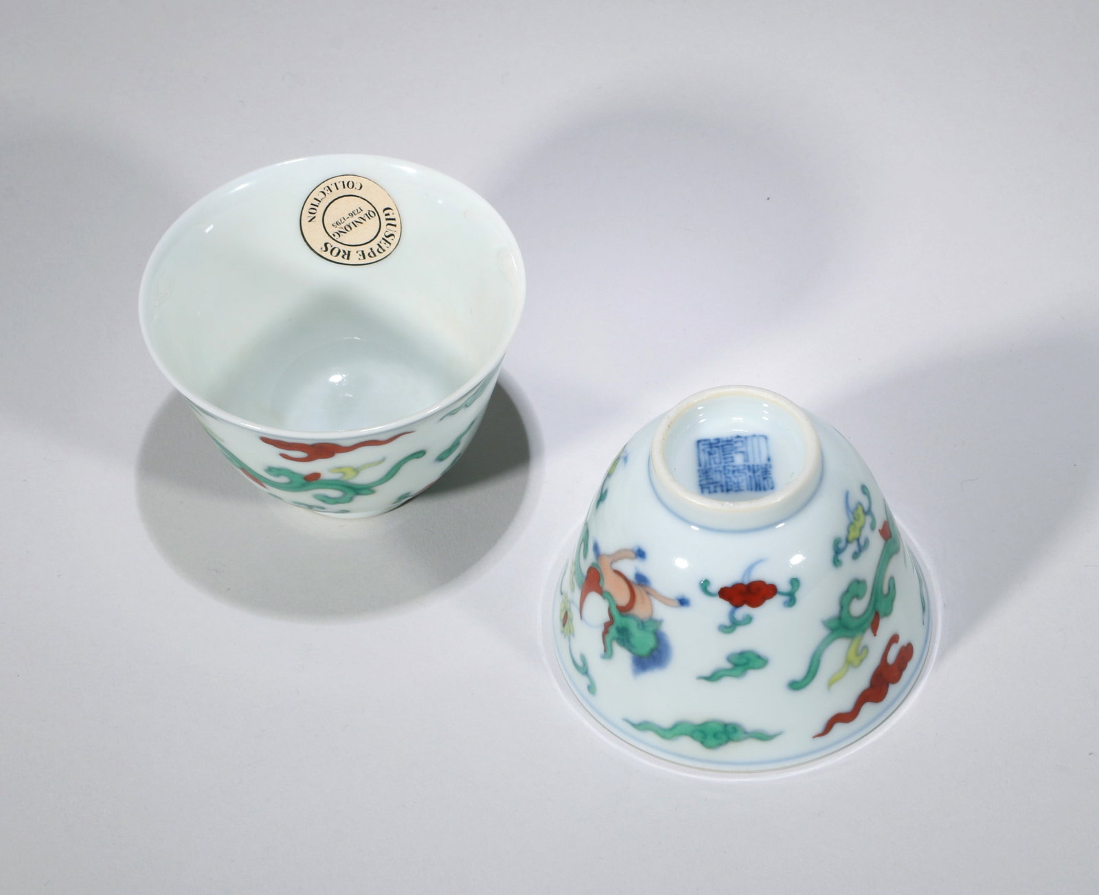 A PAIR OF DOUCAI CUPS: A pair of Doucai cups decorated with Kui-dragon design. Height 5 cm, Diameter 7.2 cm. Note: By repute, from the collection of the Italian diplomat Giuseppe Ros.