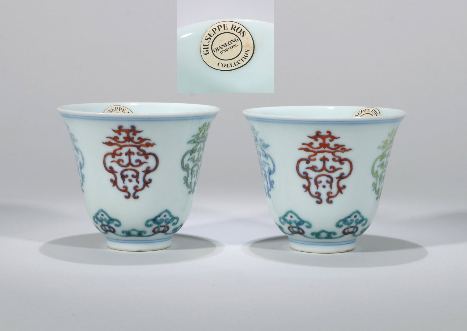 A PAIR OF DOUCAI CUPS: A pair of Doucai cups decorated with interlocking floral design. Height 7.2 cm, Diameter 8.3 cm. Note: By repute, from the collection of the Italian diplomat Giuseppe Ros.