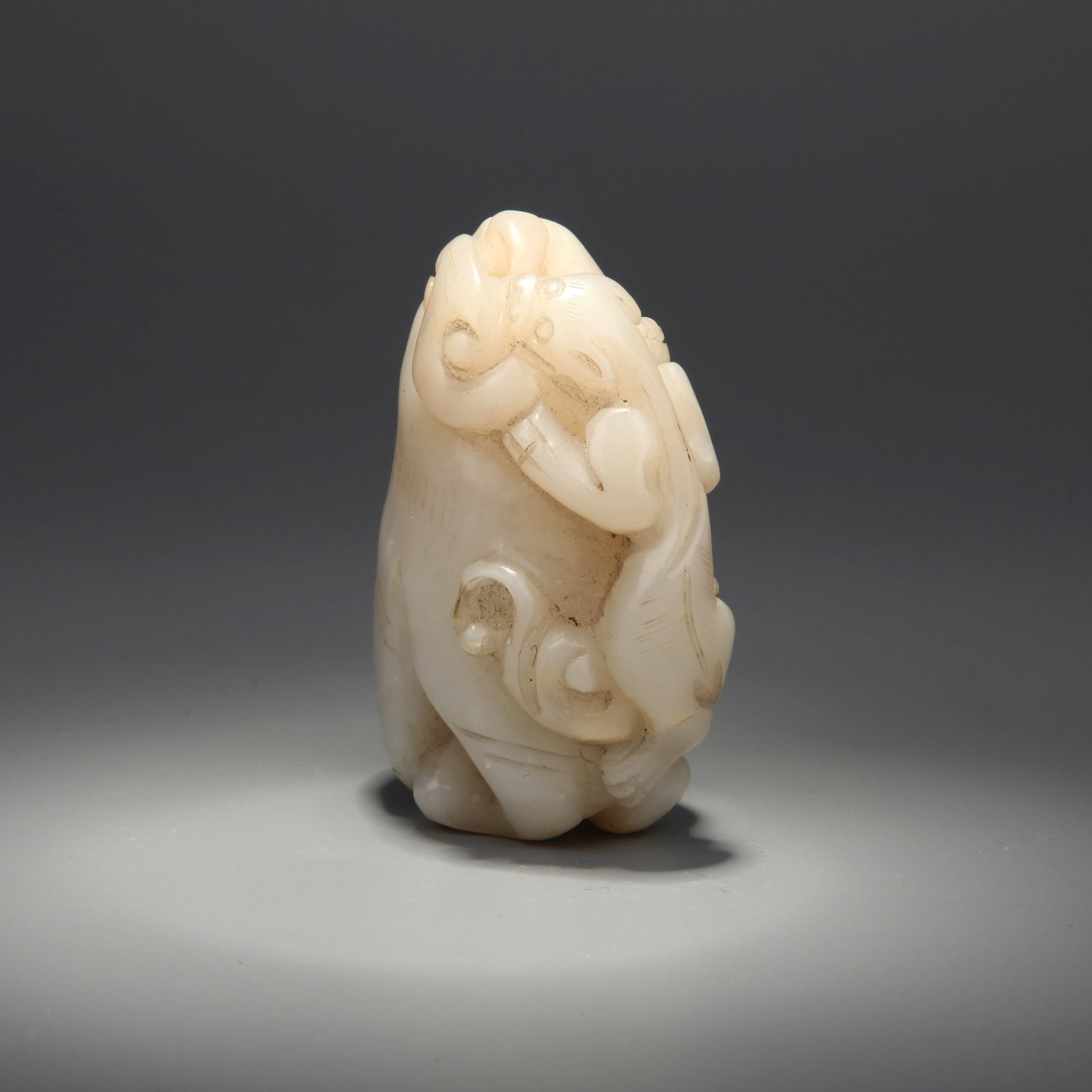 A JADE 'BUDDHA'S HAND CITRON AND CHI-DRAGON' PLAYTHING (1 of 6)