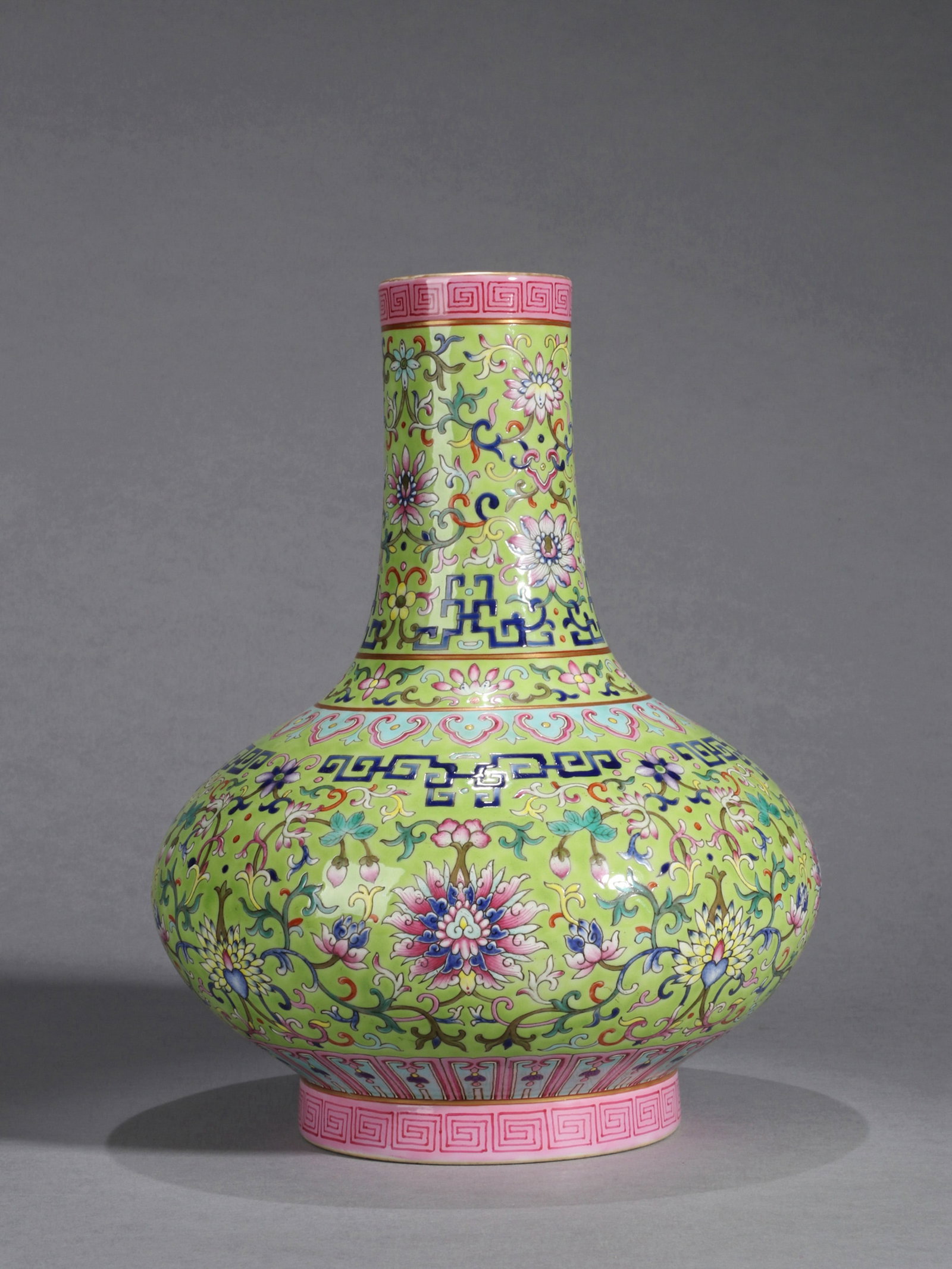 AN APPLE-GREEN-GROUND 'BAOXIANG FLOWER' VASE: An apple-green-ground vase (Biqiping) decorated with Baoxiang flower design. Height 30.4 cm.
