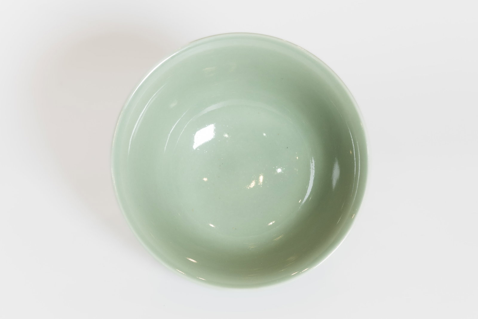 A CELADON-GLAZED PORCELAIN BOWL - 4