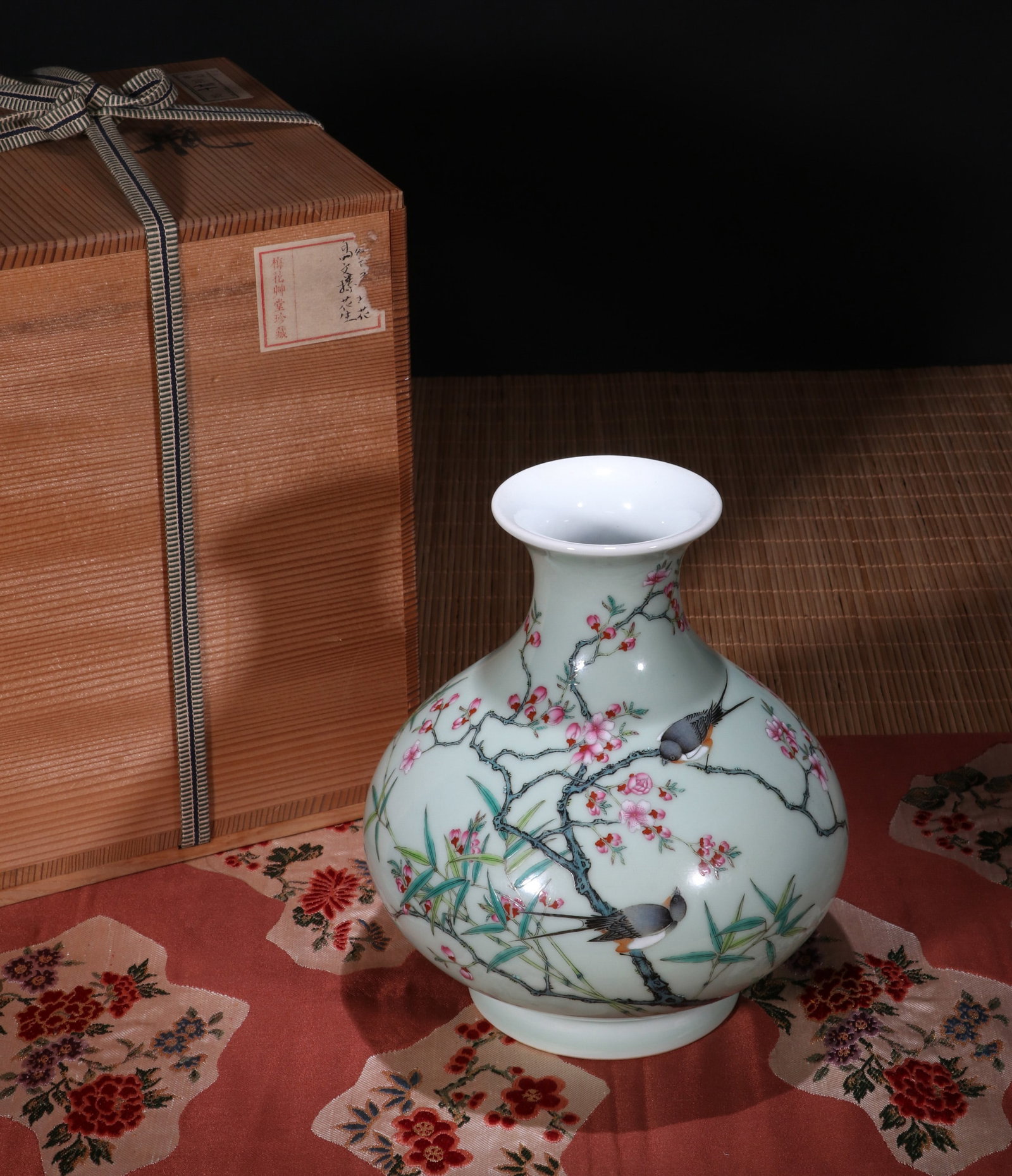A CELADON-GROUND FAMILLE ROSE 'BIRDS AND FLOWERS' VASE: A celadon-ground famille rose vase decorated with birds and flowers. Height 20.5 cm. Note: By repute, from the collection of Meihua Caotang.