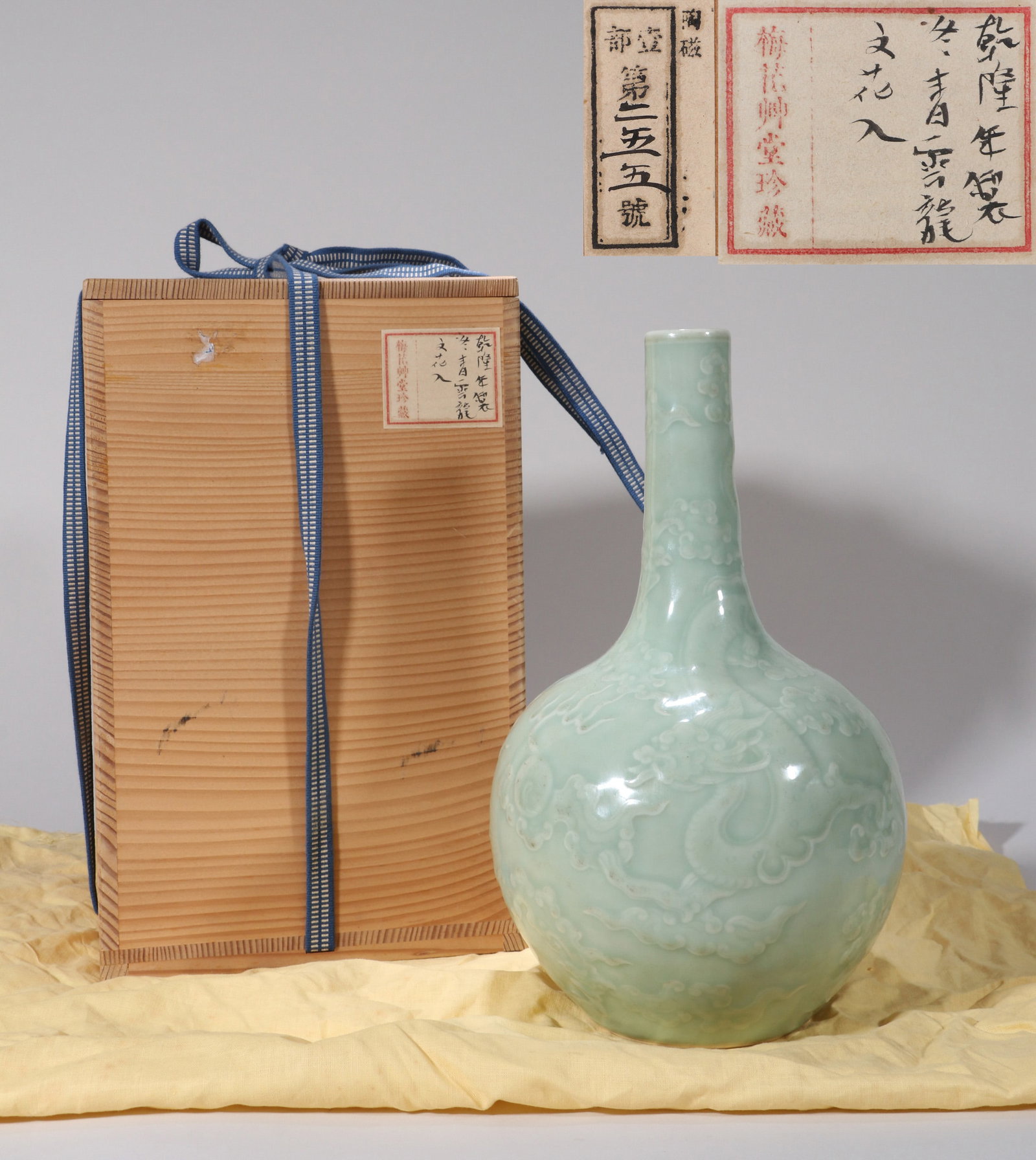 A MOULDED CELADON-GLAZED 'DRAGON' VASE (1 of 11)