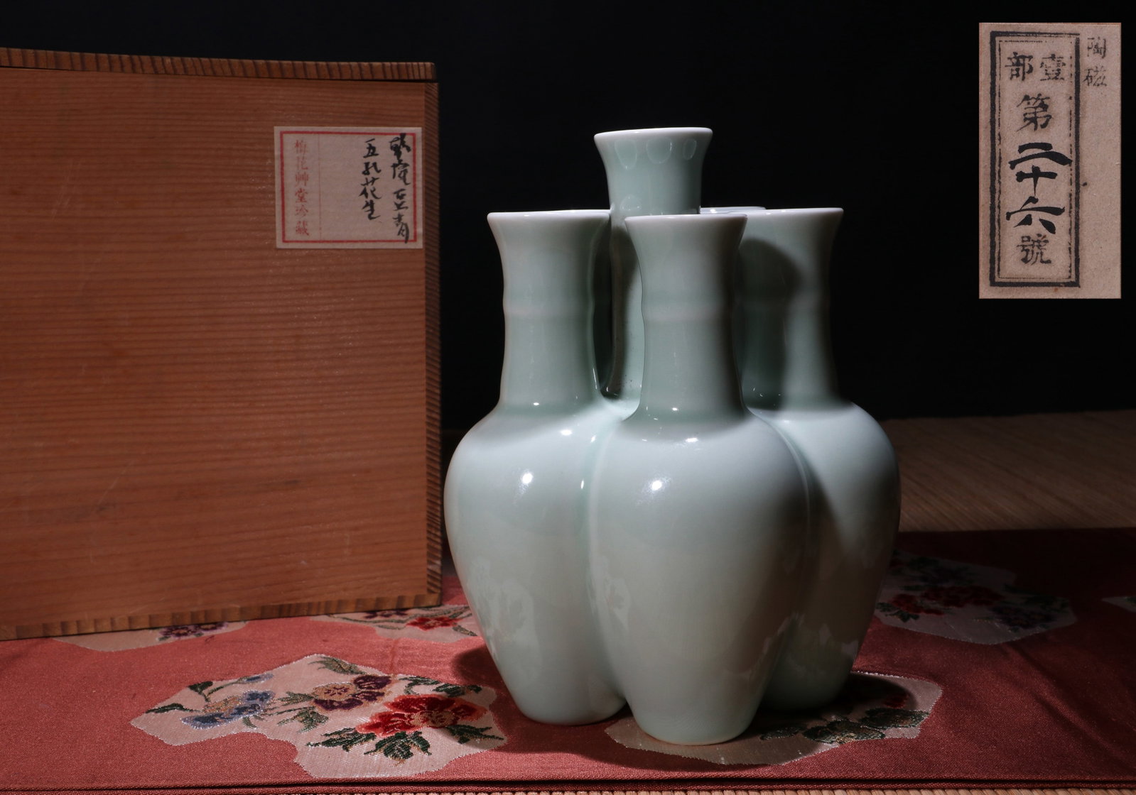 A CELADON-GLAZED FIVE-SPOUTED VASE: A celadon-glazed five-spouted vase. Height 17.5 cm. Note: By repute, from the collection of Meihua Caotang.