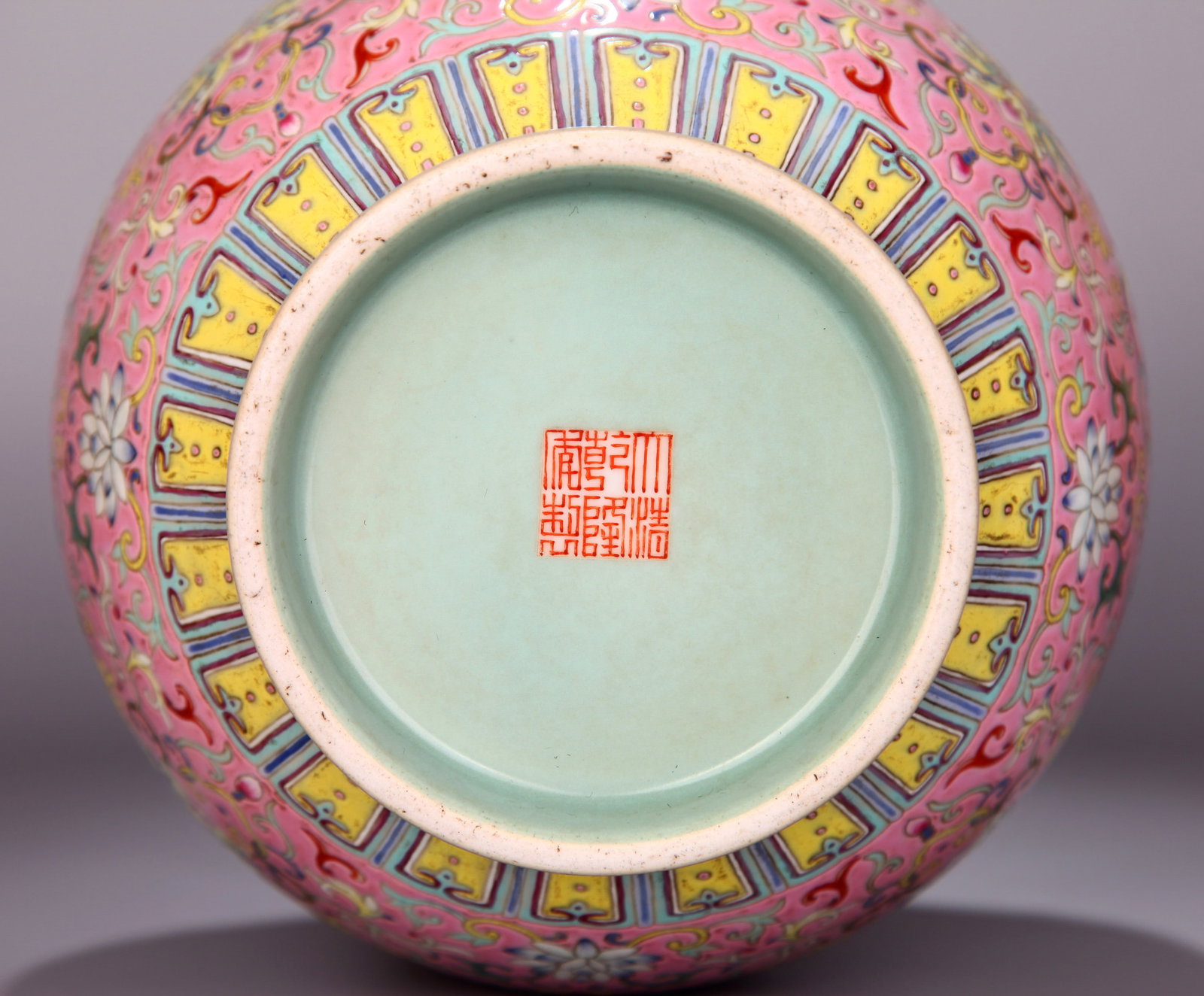 A PINK-GROUND FAMILLE ROSE 'FLORAL SCROLL' VASE: A pink-ground famille rose vase decorated with floral scrolls. Height 32.5 cm. Note: By repute, from the collection of Zhang Boju.