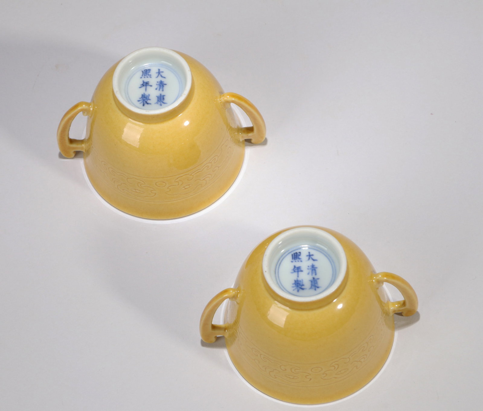 A PAIR OF YELLOW-GLAZED INCISED 'KUI DRAGON' CUPS WITH HANDLES (1 of 7)