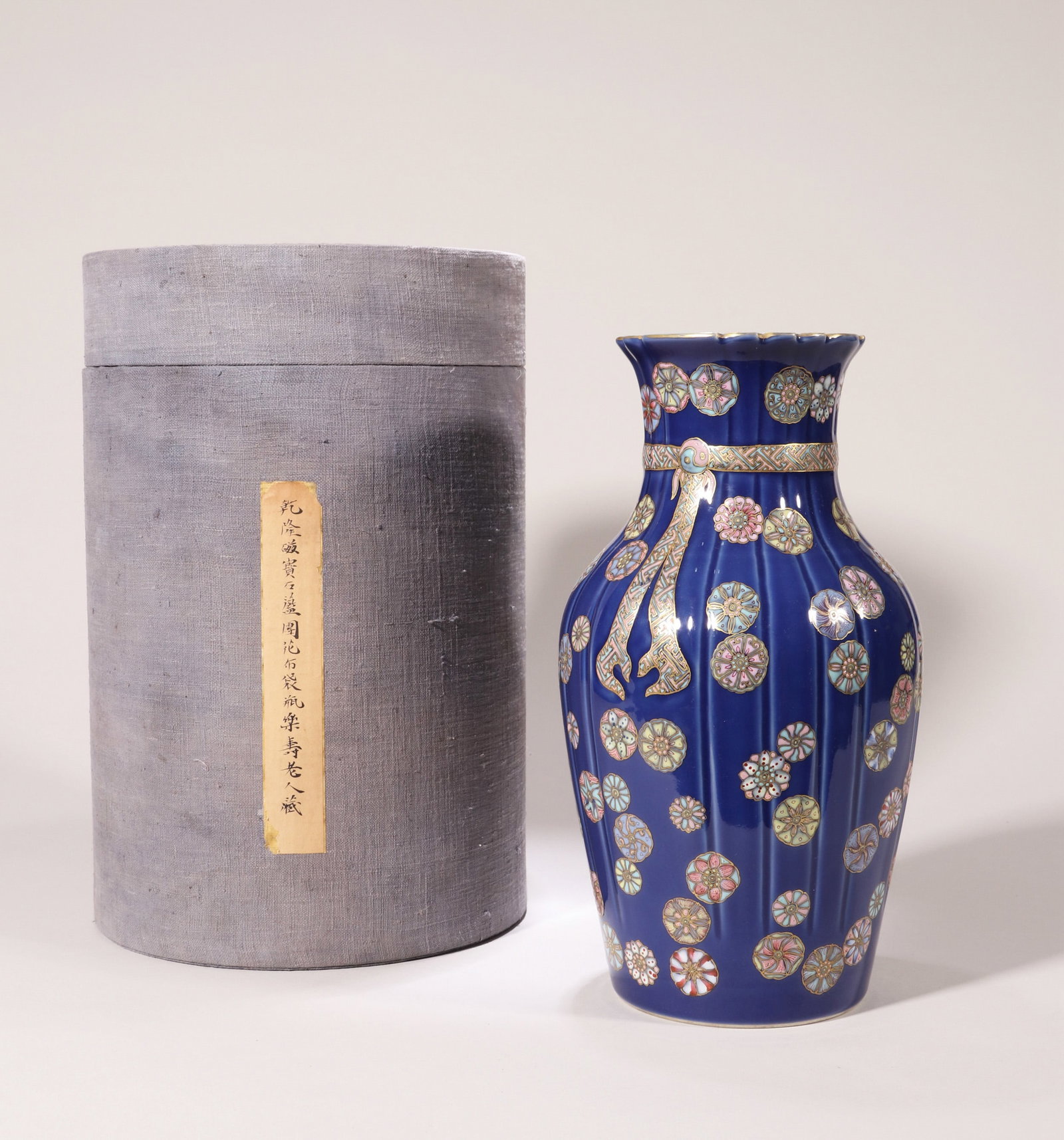 A SACRIFICIAL-BLUE-GROUND FAMILLE ROSE 'MEDALLION' WRAPPED VASE (1 of 13)