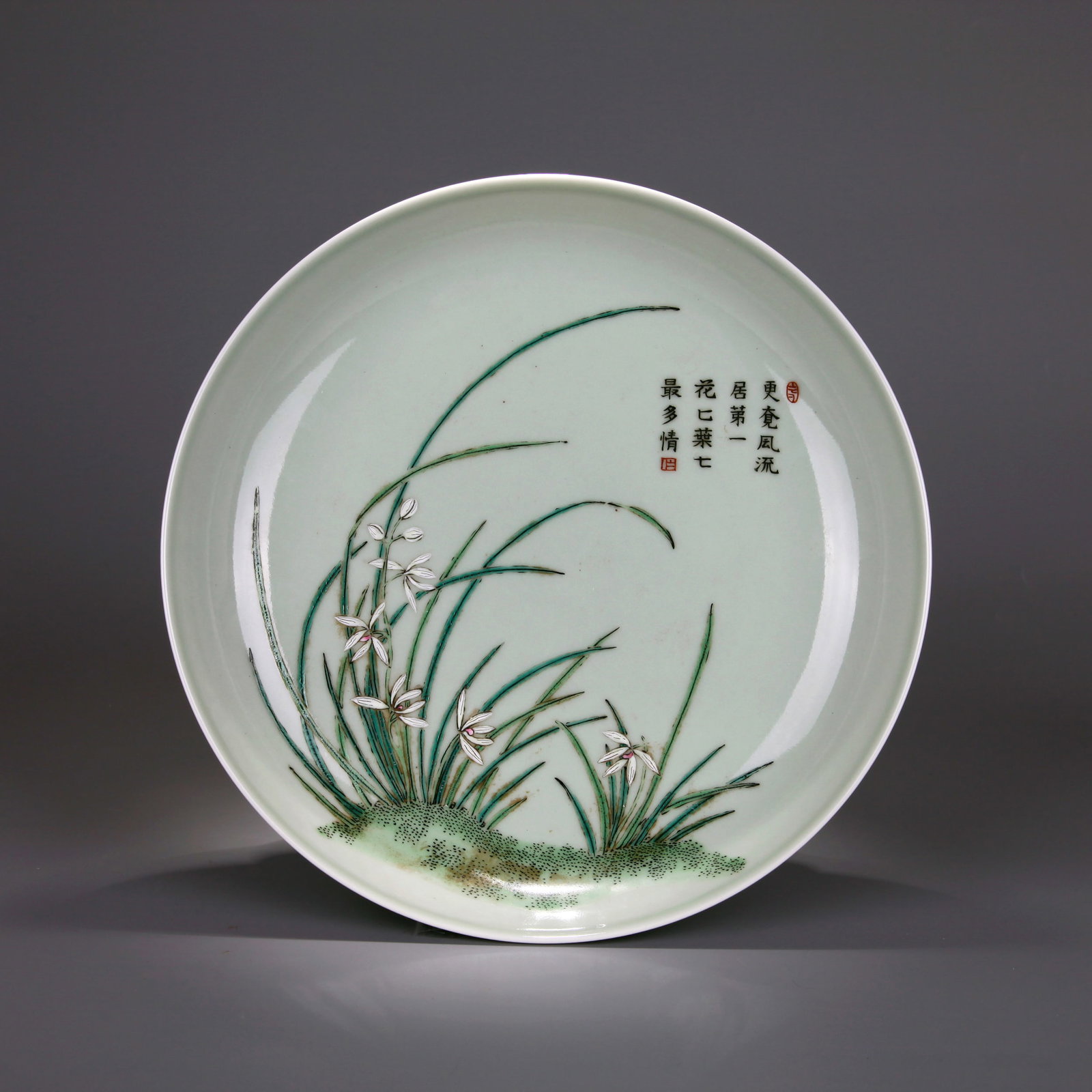 A CELADON-GLAZED FAMILLE ROSE 'ORCHID' DISH (1 of 6)