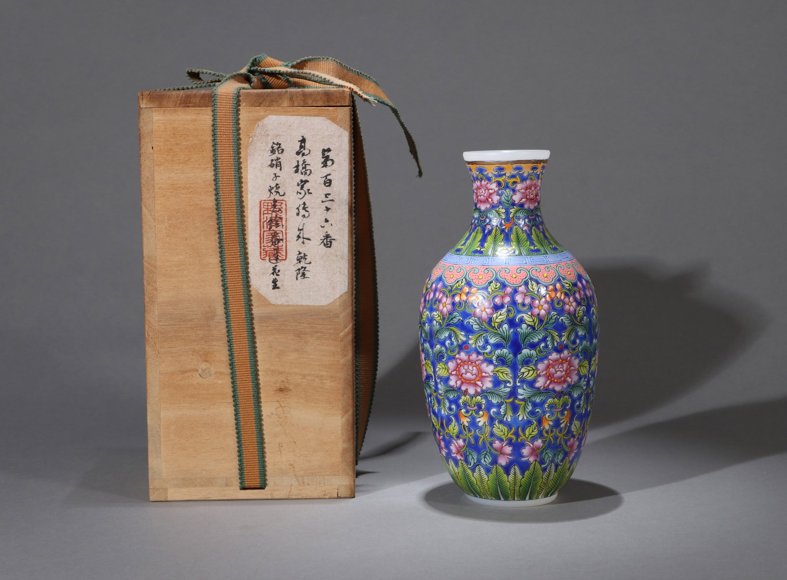 A FALANGCAI 'FLORAL' LANTERN VASE: An opaque white glass lantern vase decorated with Falangcai floral design.
