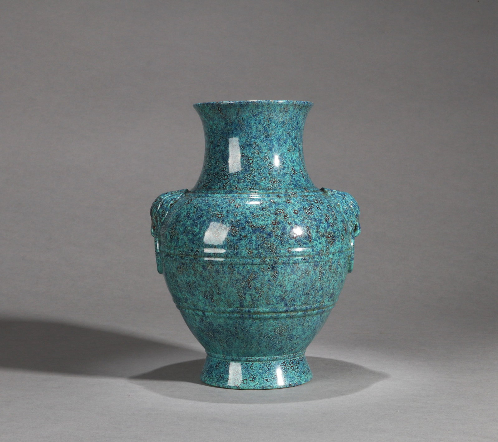 A ROBIN'S-EGG-GLAZED VASE (ZUN): A robin's-egg-glazed vase (Zun) with two mask handles.