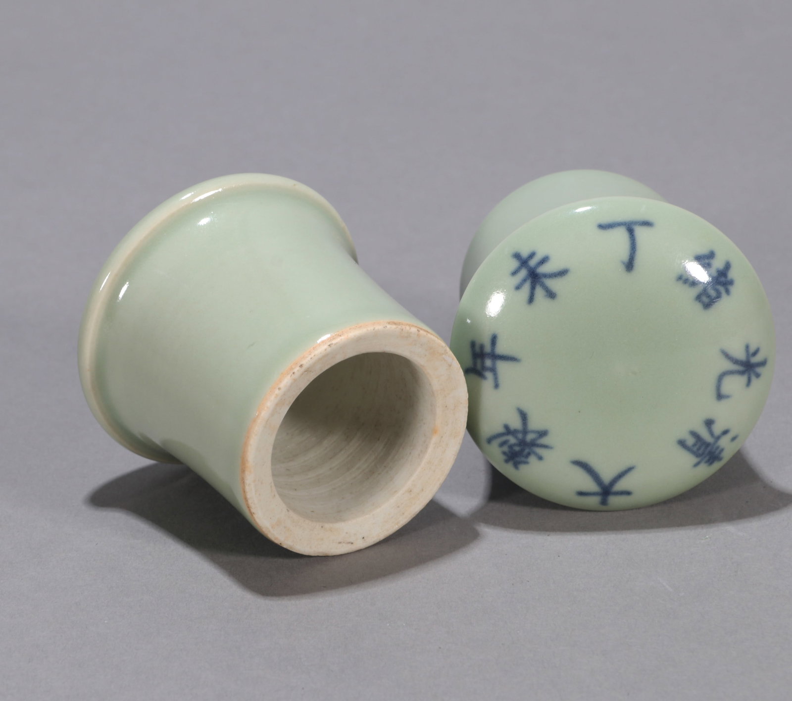 A PAIR OF CELADON-GLAZED ROLLER KNOBS - 2