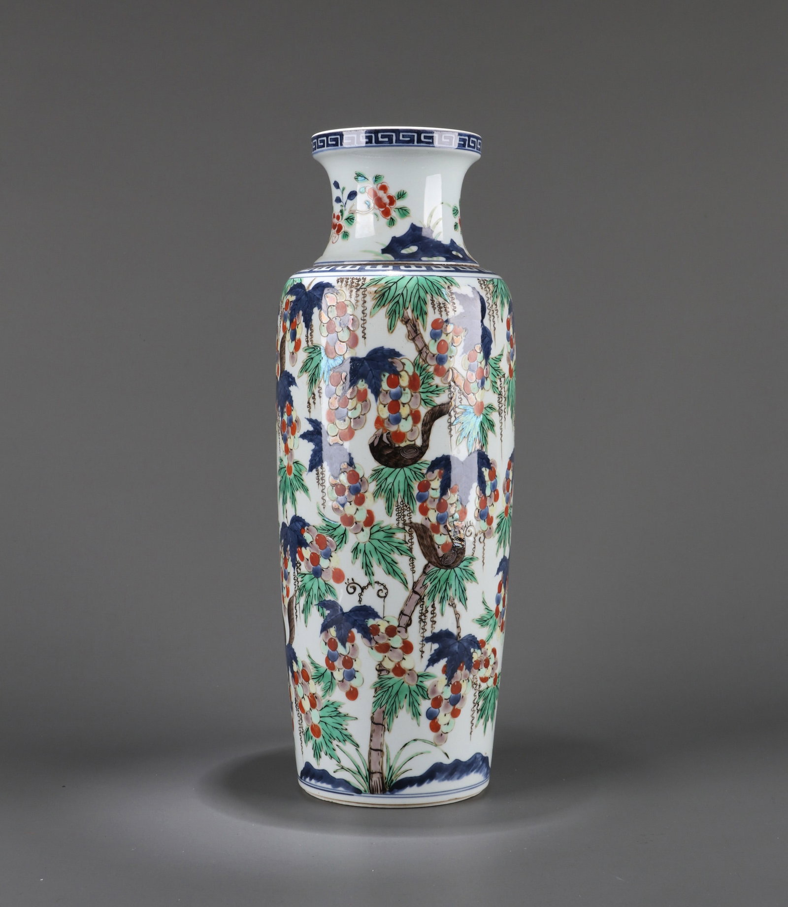 A BLUE AND WHITE, UNDERGLAZE-RED AND WUCAI 'SQUIRREL AND GRAPEVINE' SLEEVE VASE (1 of 9)