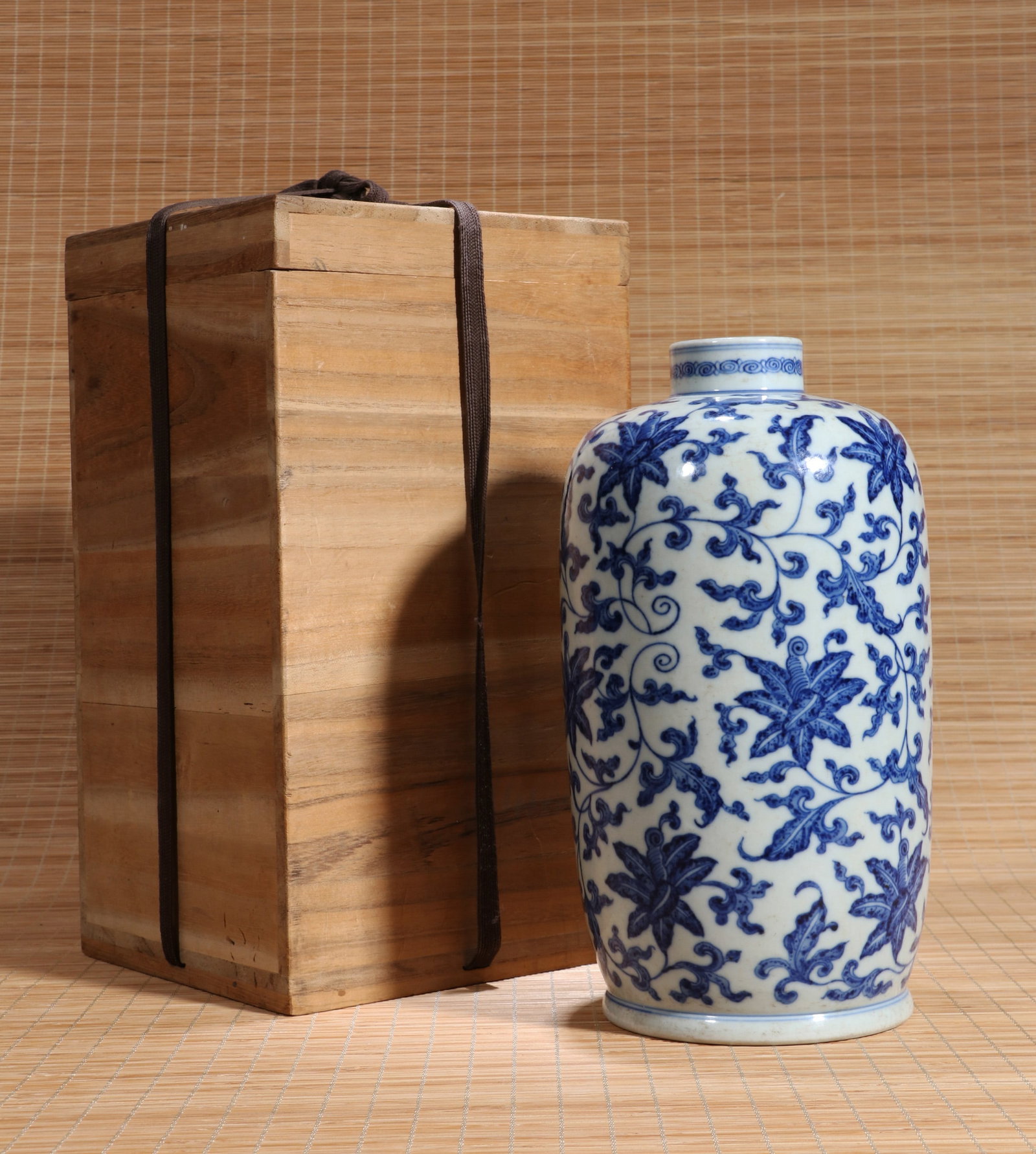 A BLUE AND WHITE 'FLORAL SCROLL' SLEEVE VASE (1 of 7)