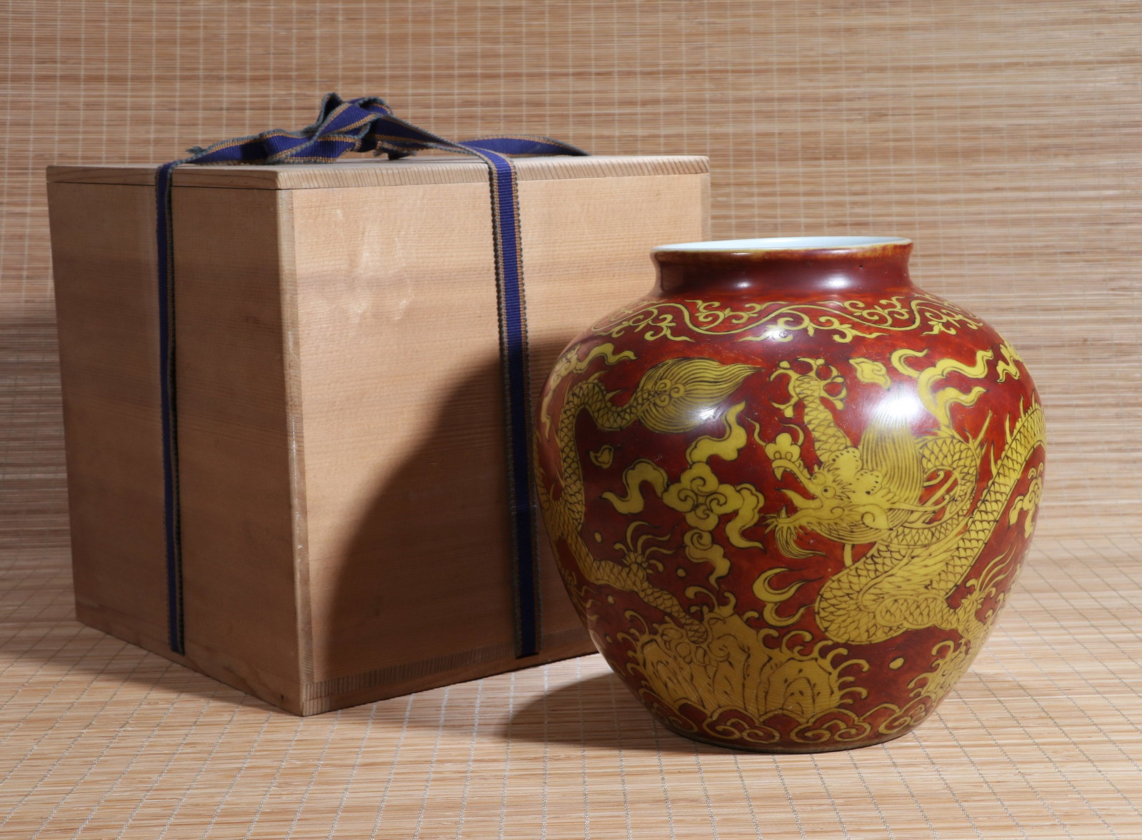 A COPPER-RED AND YELLOW-ENAMEL 'DRAGON AMID CLOUDS' JAR: A copper-red and yellow-enamel 'dragon amid clouds' jar. Height 20.5 cm.