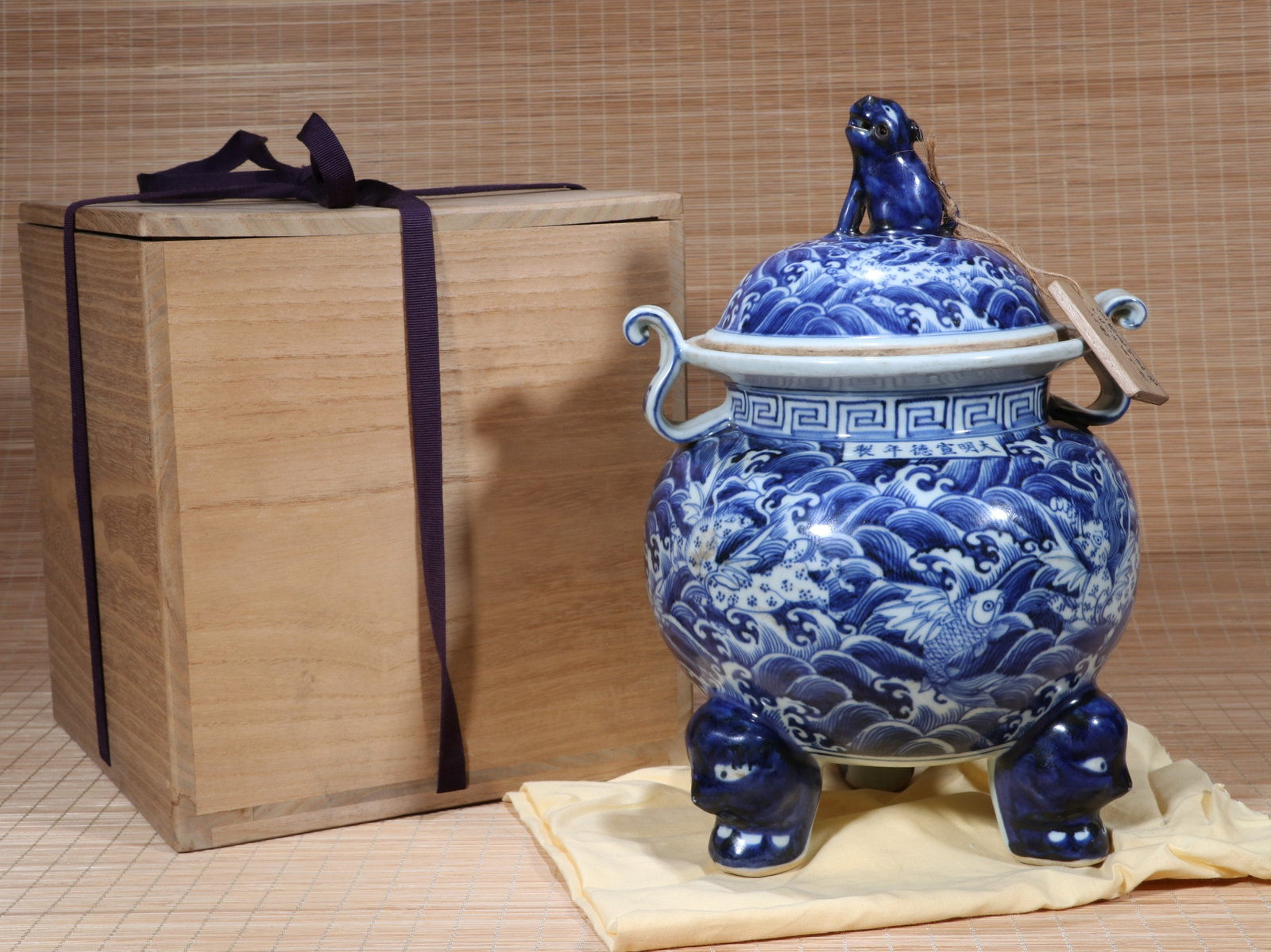 A BLUE AND WHITE RESERVE-DECORATED 'FISH TRANSFORMING INTO DRAGON AMID WAVES' TWO-HANDLED CENSER (1 of 10)