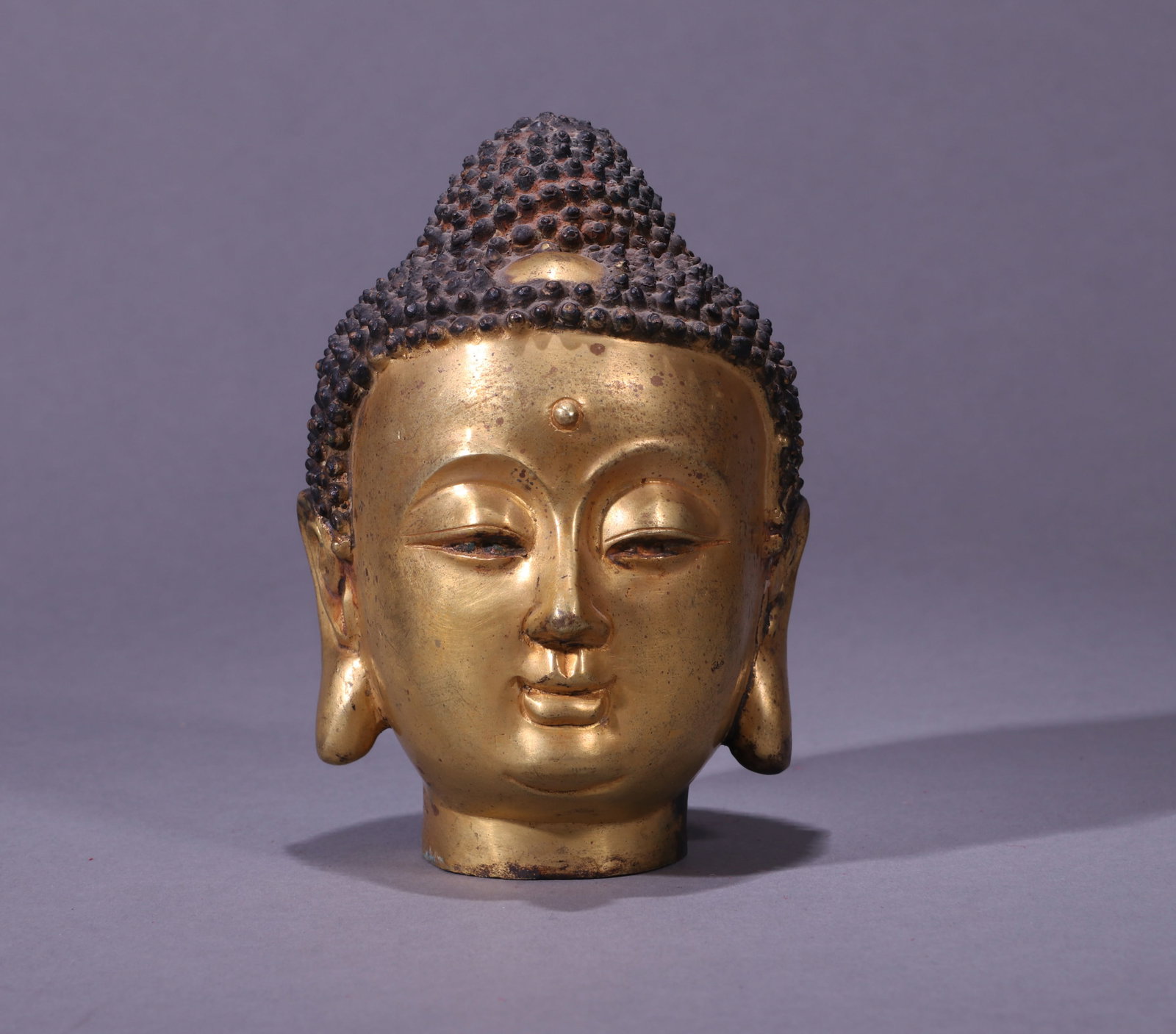 A GILT-BRONZE BUDDHA HEAD (1 of 5)