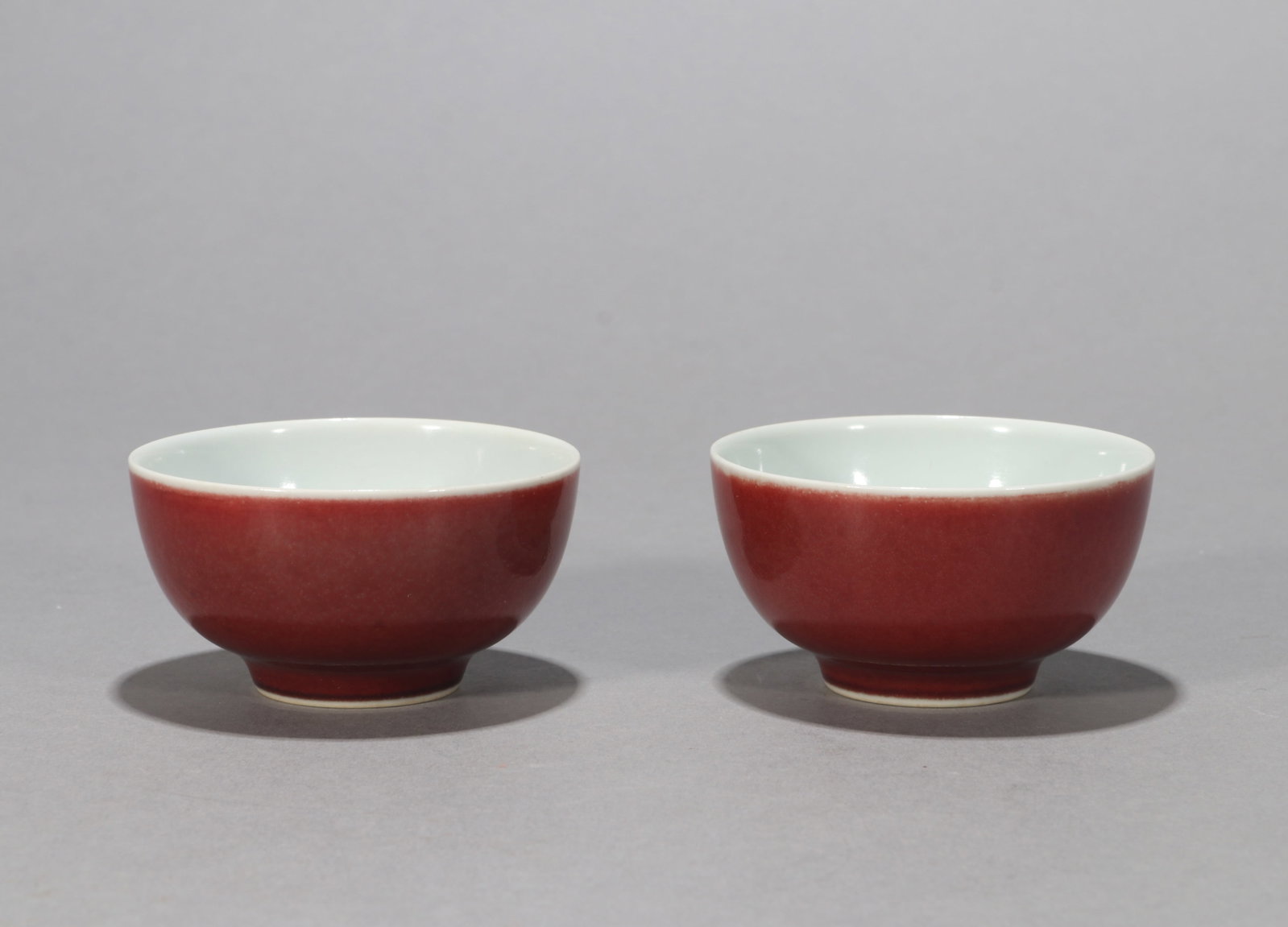 A PAIR OF COPPER-RED-GLAZED TEA BOWLS
