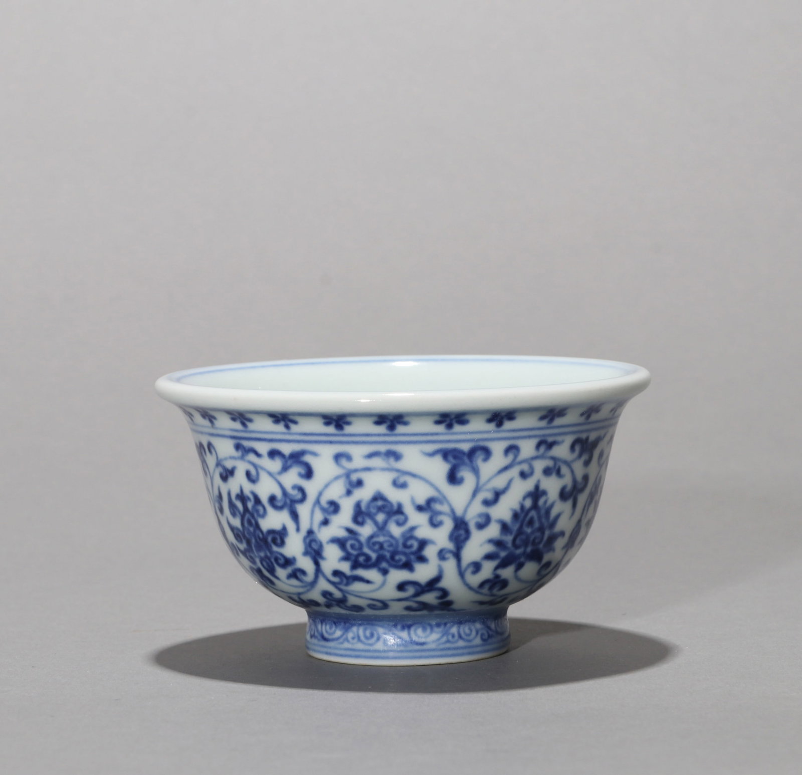 A BLUE-AND-WHITE 'LOTUS SCROLL' CUP