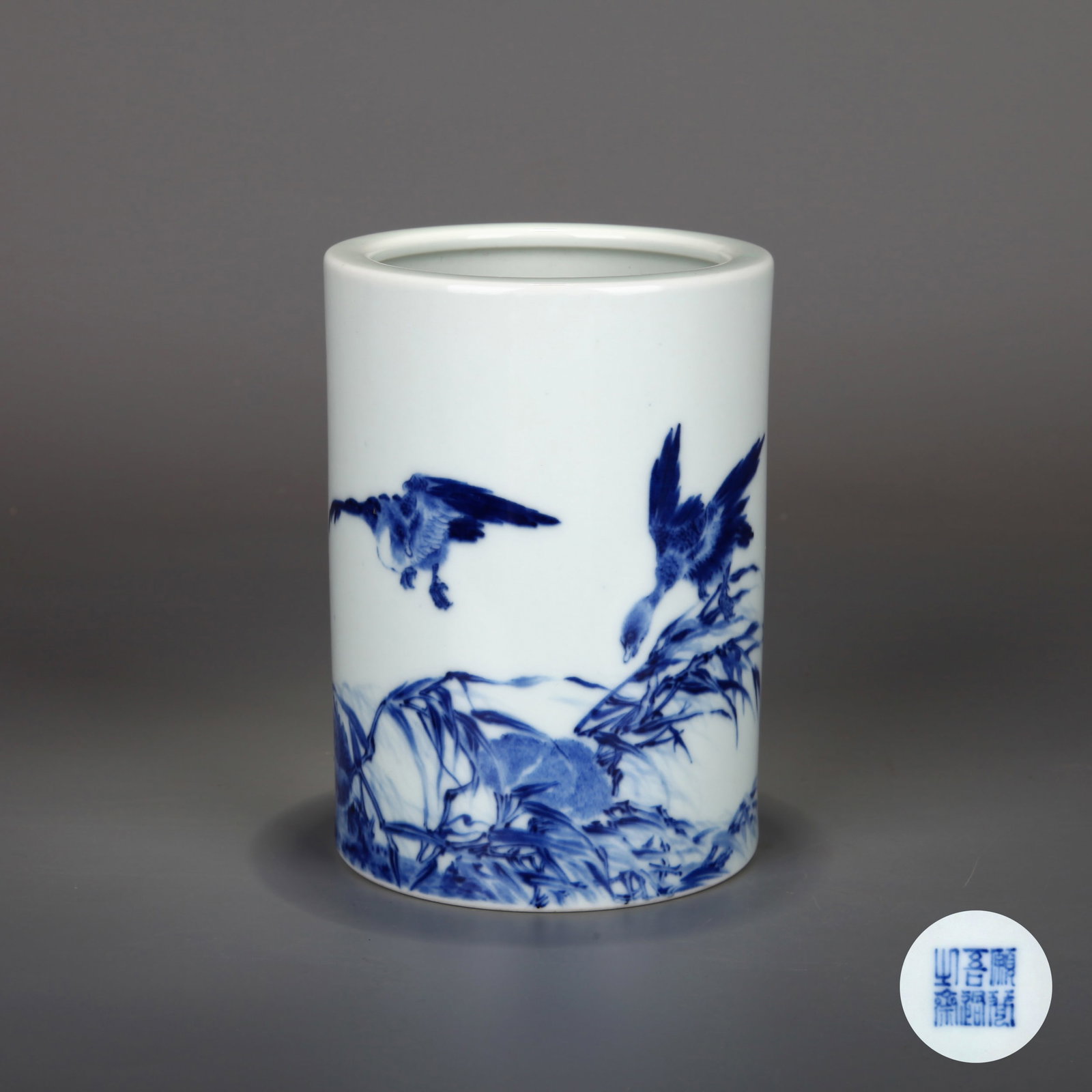 A BLUE-AND-WHITE 'BIRD AND FLOWER' BRUSHPOT, BEARING A MARK IN THE NAME OF WANG BU