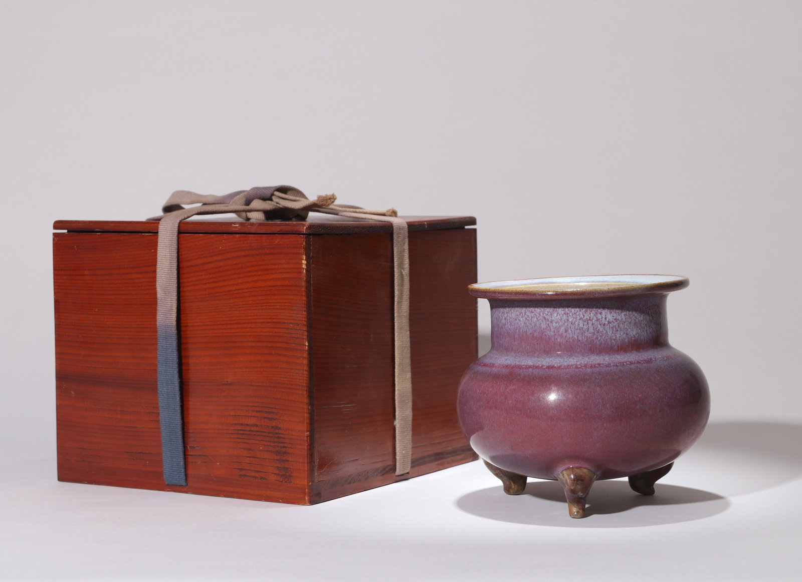 A ROSE-PURPLE-GLAZED TRIPOD CENSER