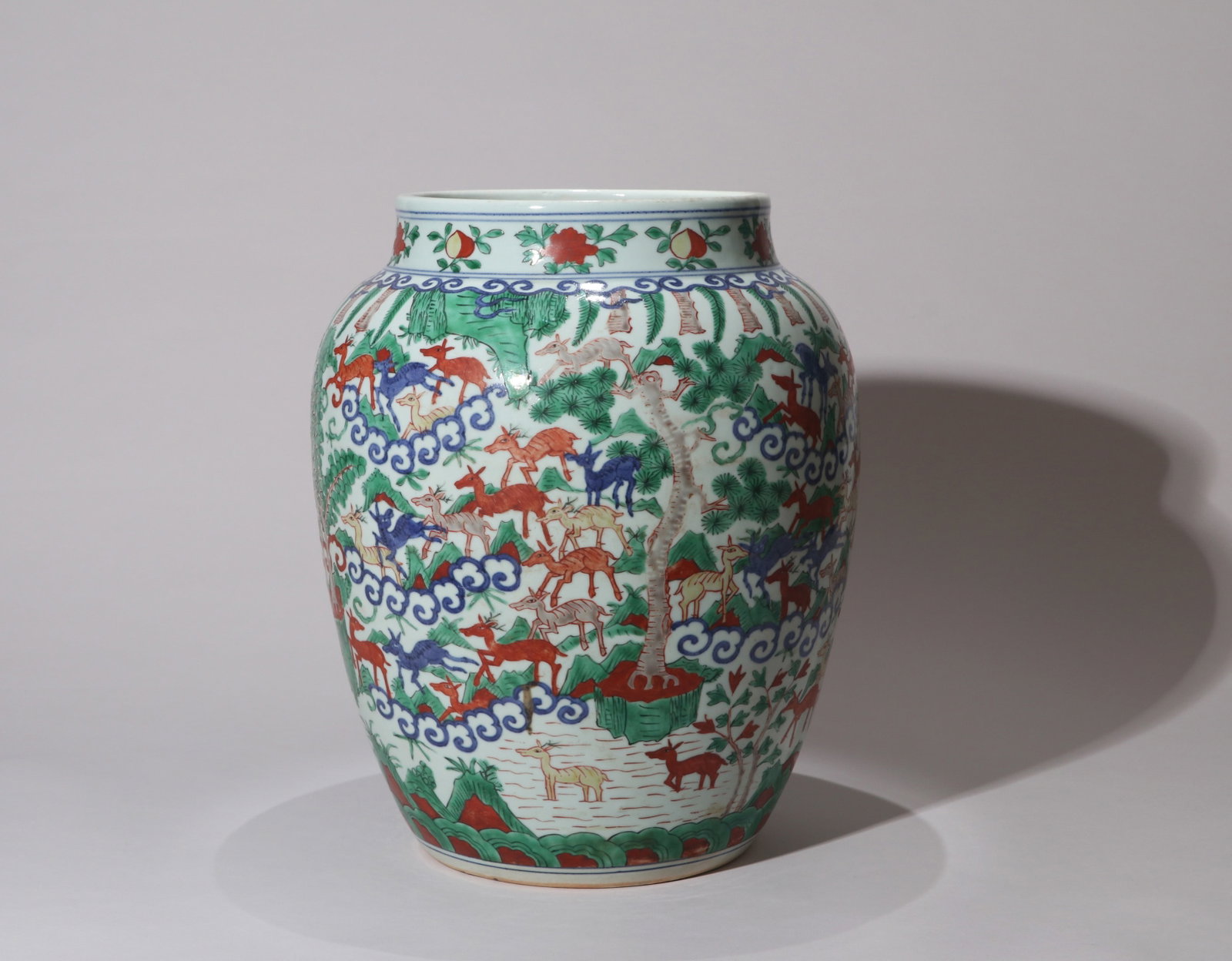 A LARGE BLUE-AND-WHITE AND WUCAI 'HUNDRED DEER' JAR (1 of 13)