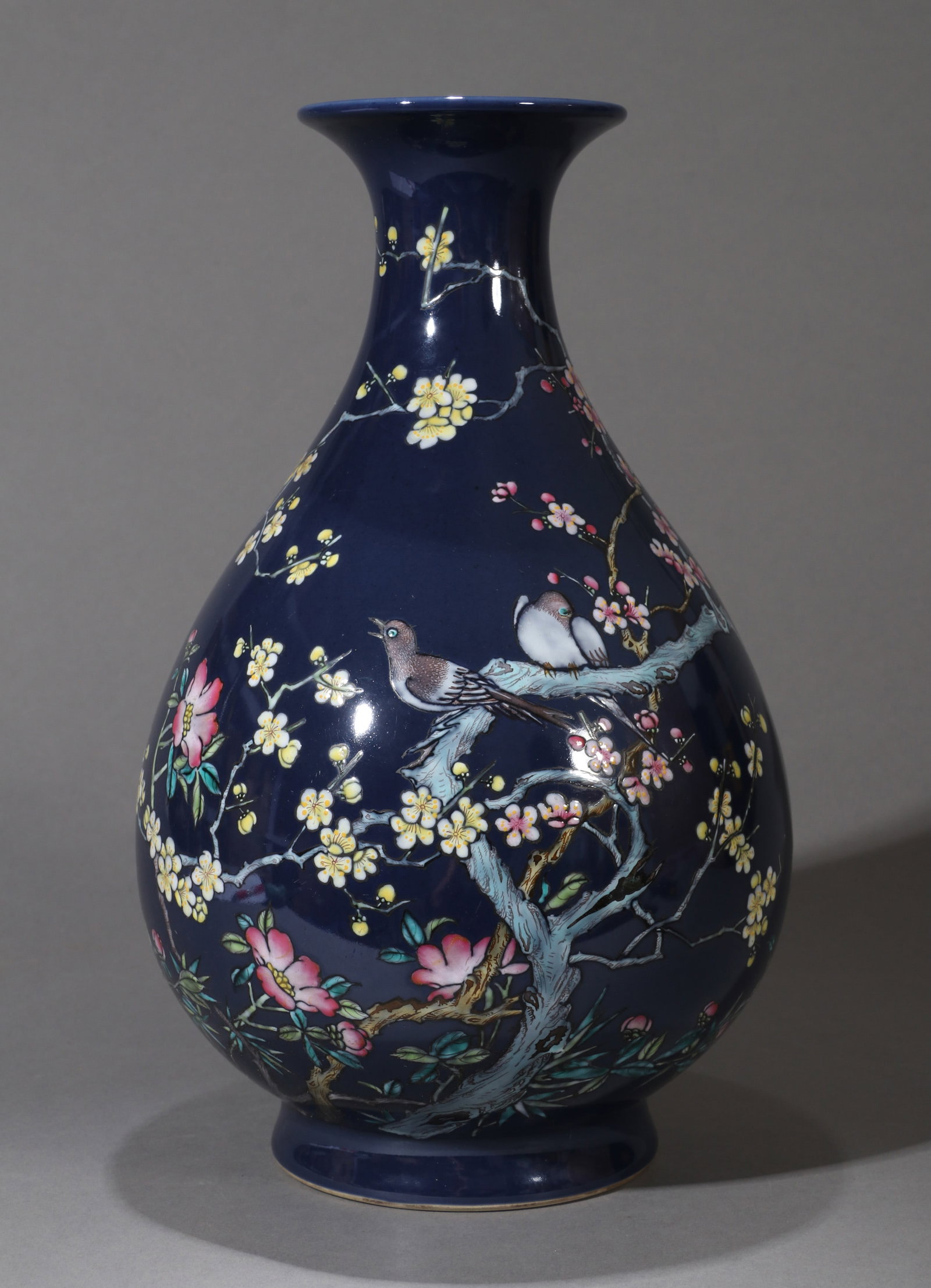 A SACRIFICIAL-BLUE-GROUND FAMILLE-ROSE 'BIRD AND FLOWER' YUHUCHUNPING VASE: A sacrificial-blue-ground famille-rose yuhuchunping vase with birds and flowers. Height 30 cm.