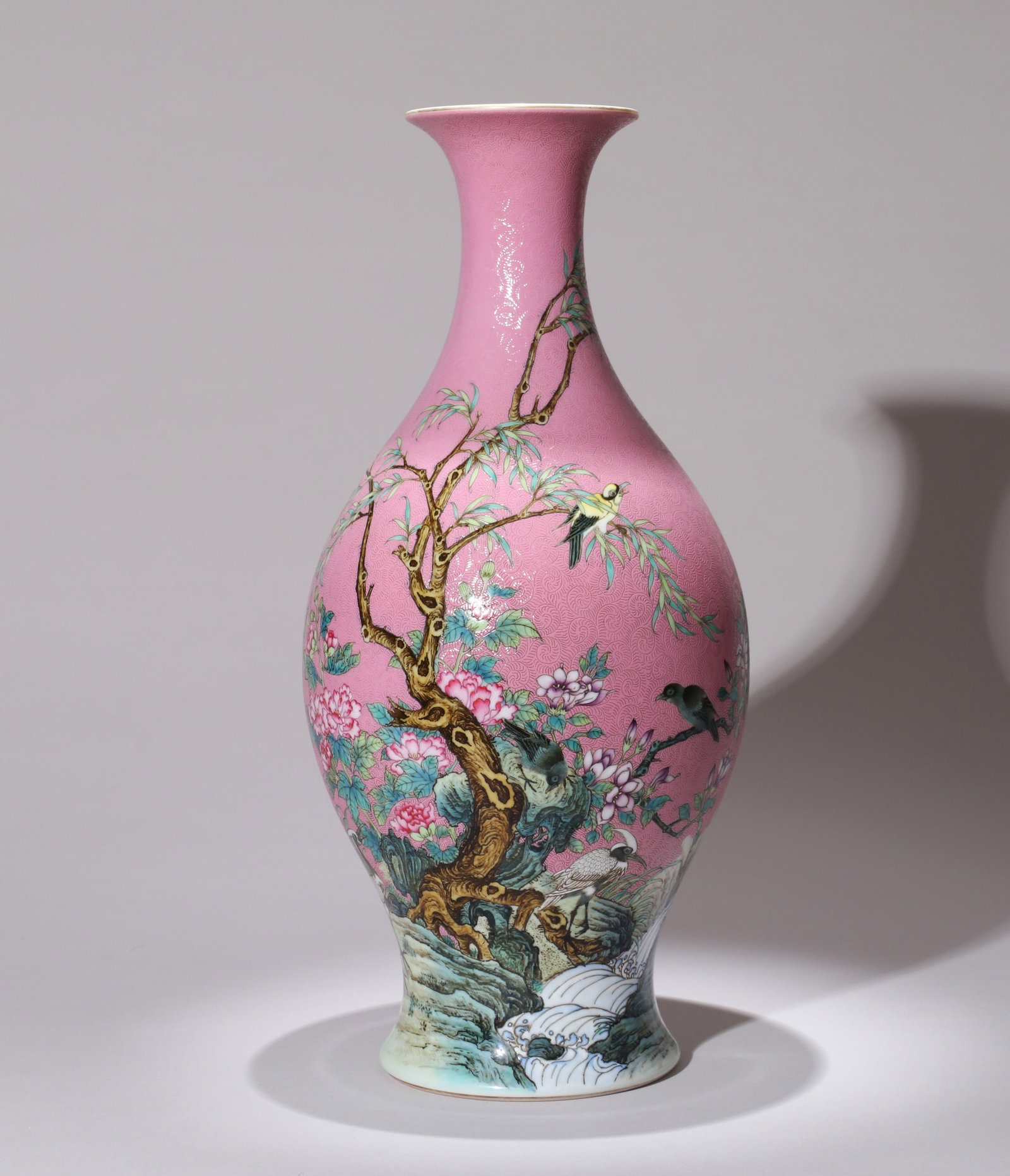A PINK-GROUND SGRAFFITO FAMILLE-ROSE 'BIRD AND FLOWER' OLIVE-FORM VASE: A pink-ground sgraffito famille-rose olive-form vase with birds and flowers. Height 36 cm.