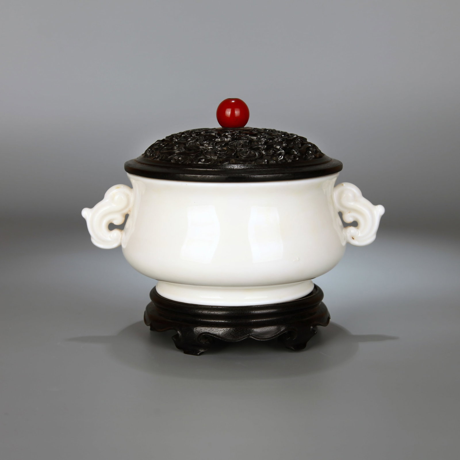A DEHUA-TYPE TWO-HANDLED CENSER WITH WOODEN COVER AND STAND