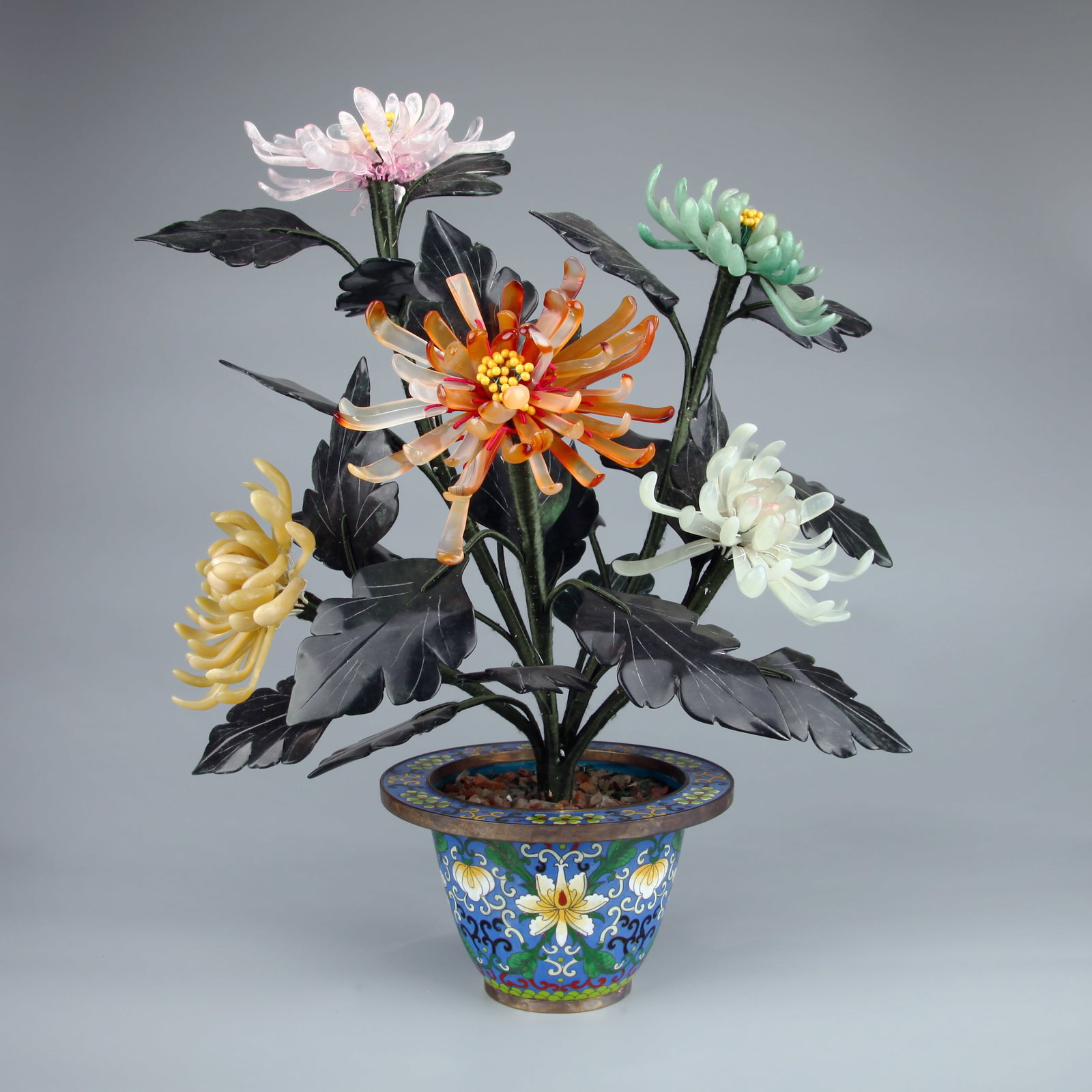 A CLOISONNE ENAMEL JARDINIERE WITH HARDSTONE CHRYSANTHEMUMS