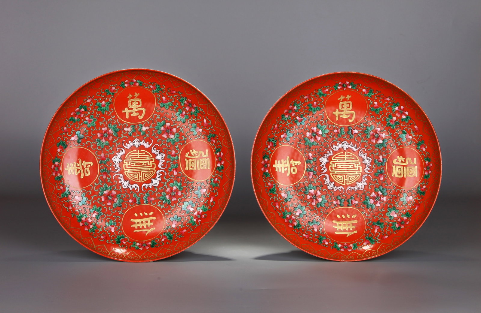 A PAIR OF RUBY-RED-GROUND FAMILLE-ROSE DISHES WITH GOURDS AND LONGEVITY INSCRIPTIONS