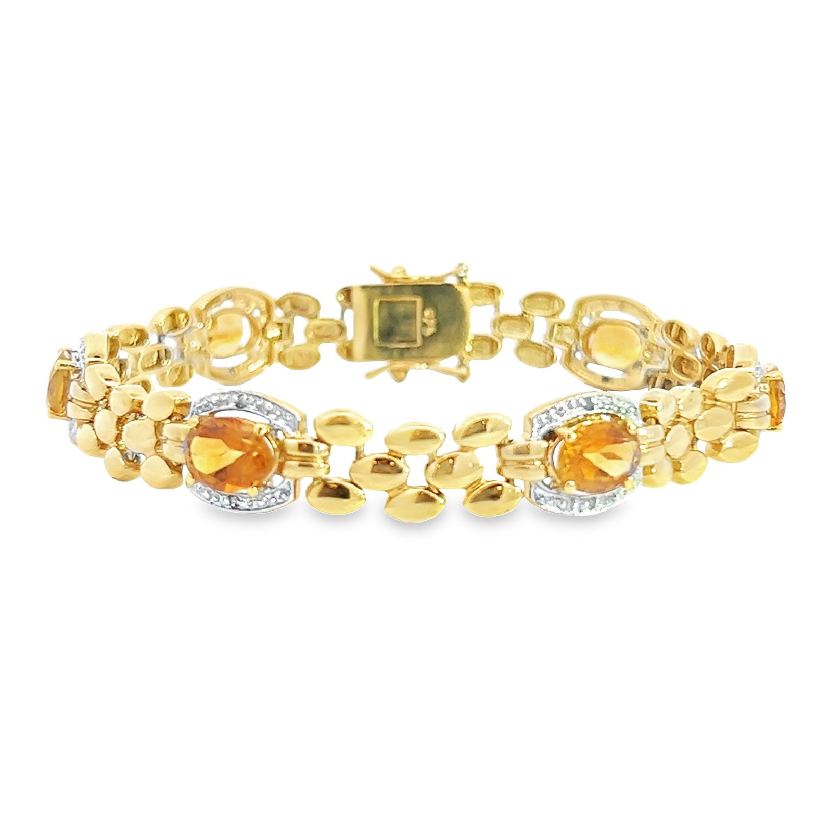 CITRINE, DIAMOND AND STERLING SILVER BRACELET: Citrine, diamond and sterling silver bracelet, adorned with citrine and diamonds, crafted in a graduated line of oval citrines. 7.87"l x 0.39"w (20 x 1 cm); 19.6 grams