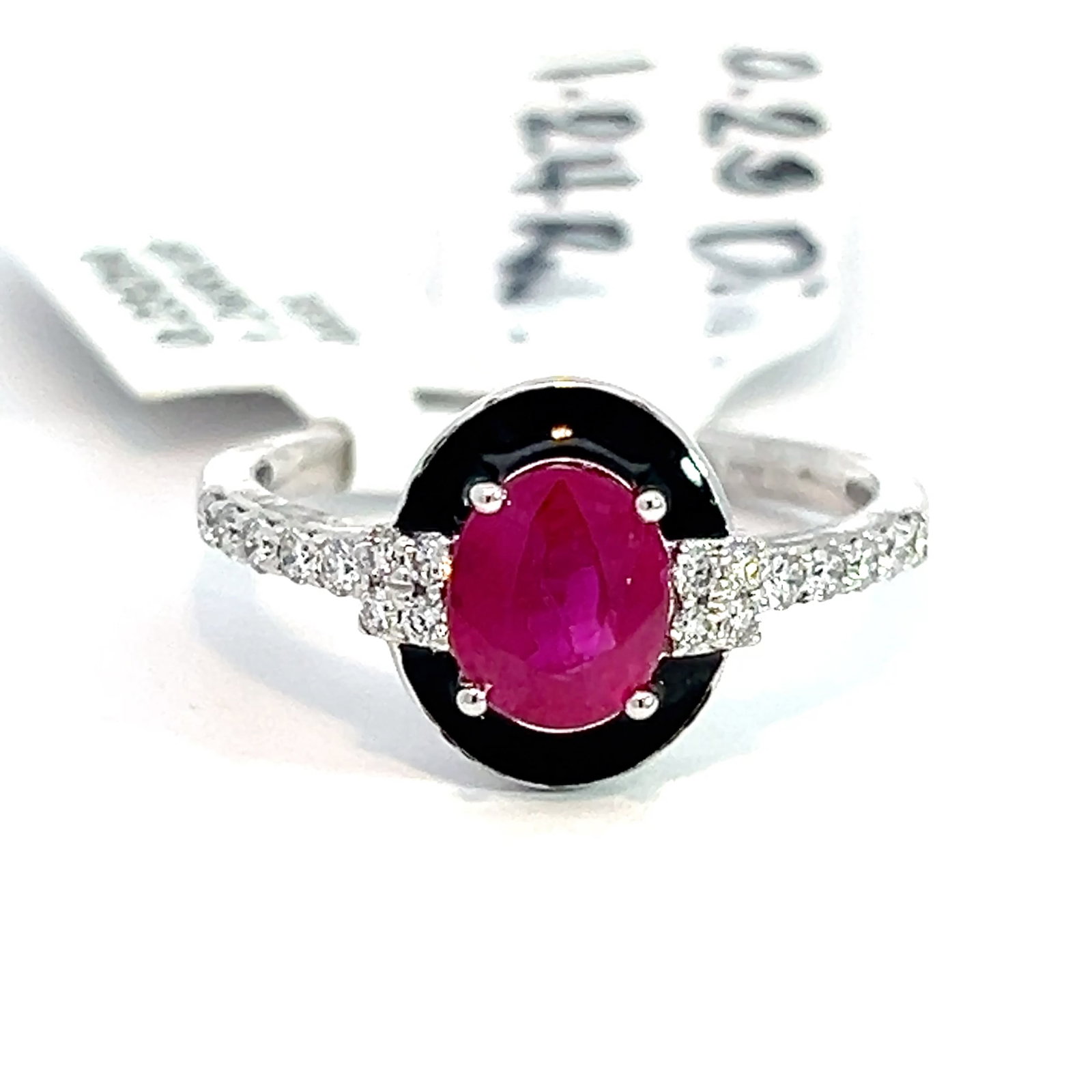 PLATINUM, RUBY AND DIAMOND RING WITH AIGL: Platinum, ruby and diamond ring with AIGL. 4.2 grams platinum ring set with 0.23 carats of diamonds and 1.24 carats of ruby (AIGL). Size: 6.75
