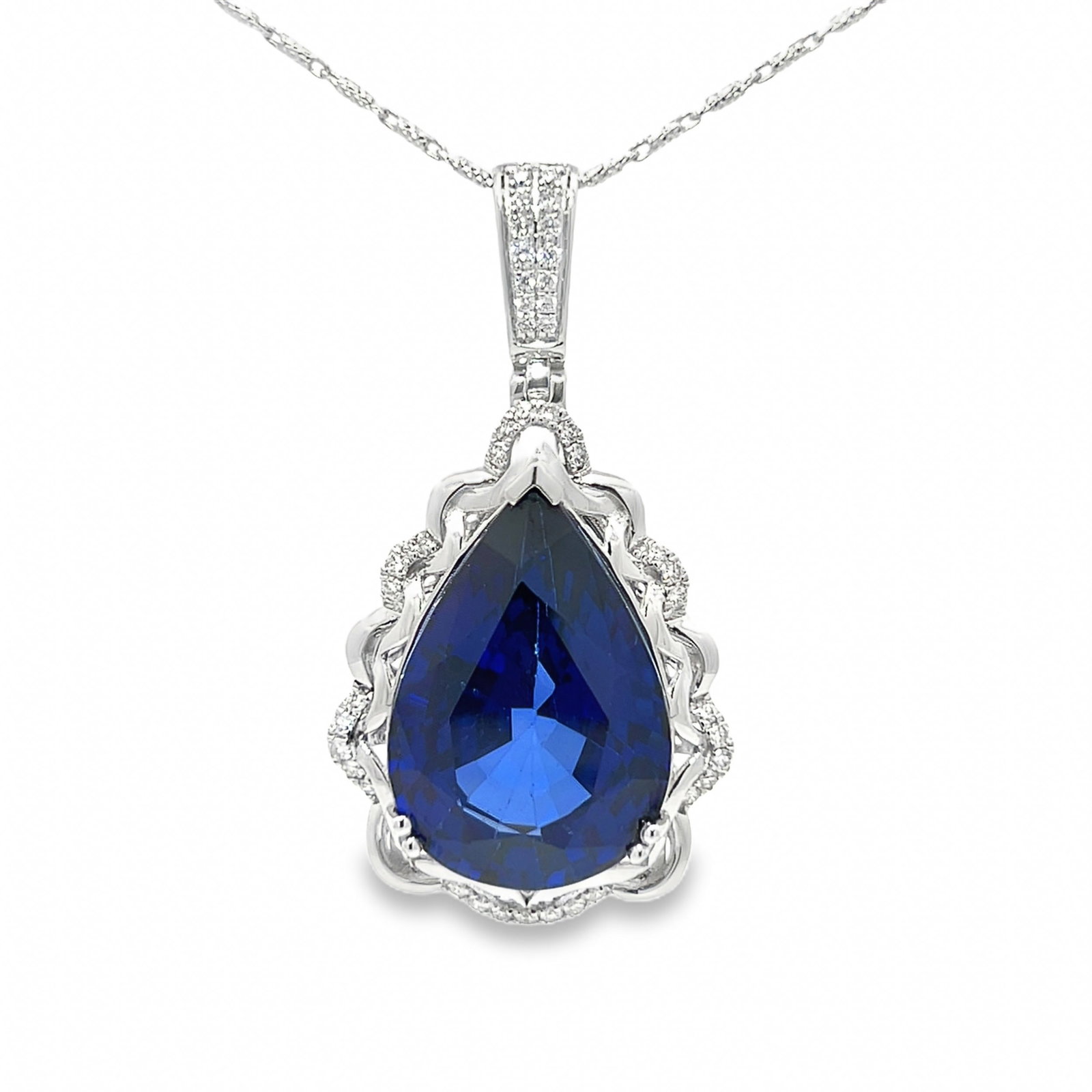 14K GOLD, LAB SAPPHIRE AND DIAMOND NECKLACE WITH GGA REPORT: 14K gold, lab sapphire and diamond necklace with GGA report. 14.4 grams 14K gold necklace set with 0.39 carats of diamonds and 27.51 carats of lab-created sapphire. Necklace: L22.5 cm (x2); Pendant: 4