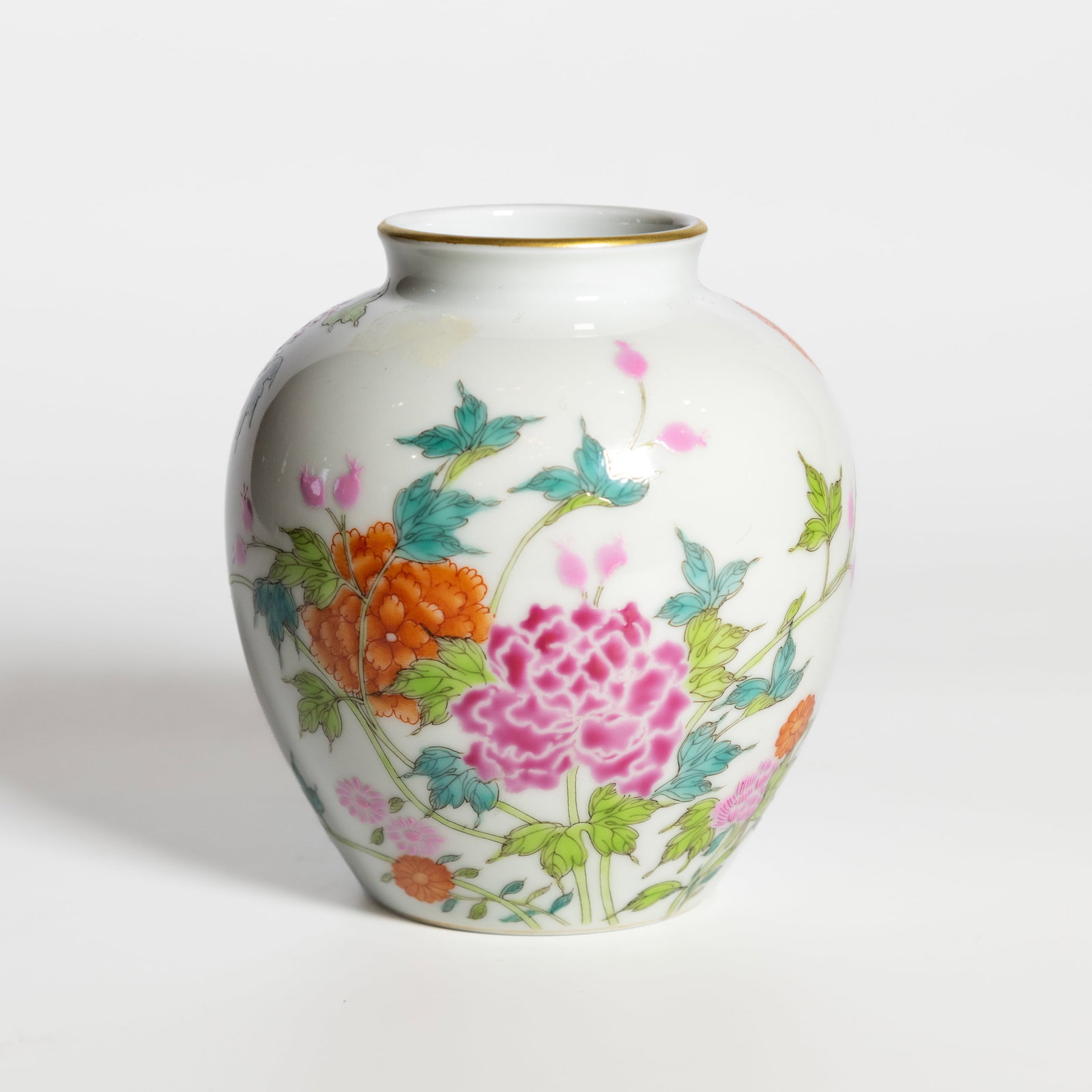 A FAMILLE-ROSE 'FLORAL' JAR, YONGZHENG MARK: A famille-rose 'floral' jar, Yongzheng mark. H11.5 x 10 cm