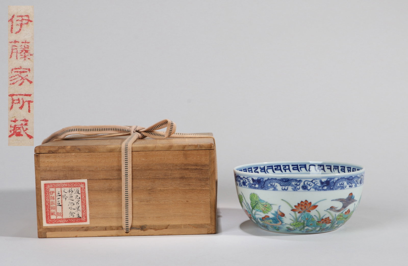 A DOUCAI 'MANDARIN DUCKS AND LOTUS POND' DRUM-FORM BOWL: A doucai drum-form bowl decorated with mandarin ducks in a lotus pond. Diameter 17 cm, height 7 cm. Note: By repute, from the Ito family collection.