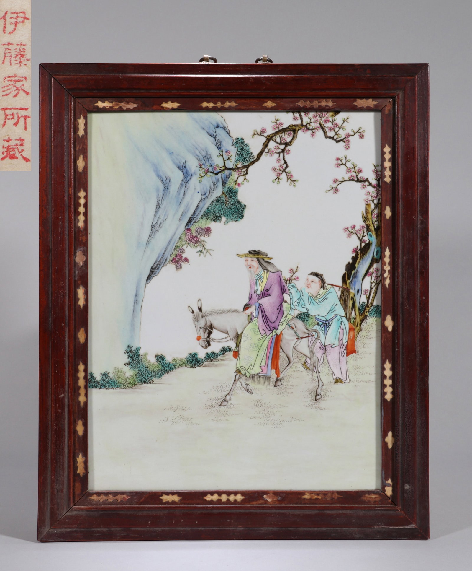 A FAMILLE-ROSE PORCELAIN PANEL, SEARCHING FOR PLUM BLOSSOMS IN SNOW: A famille-rose porcelain panel depicting a figure searching for plum blossoms in snow. 36 x 28 cm. Note: By repute, from the Ito family collection.