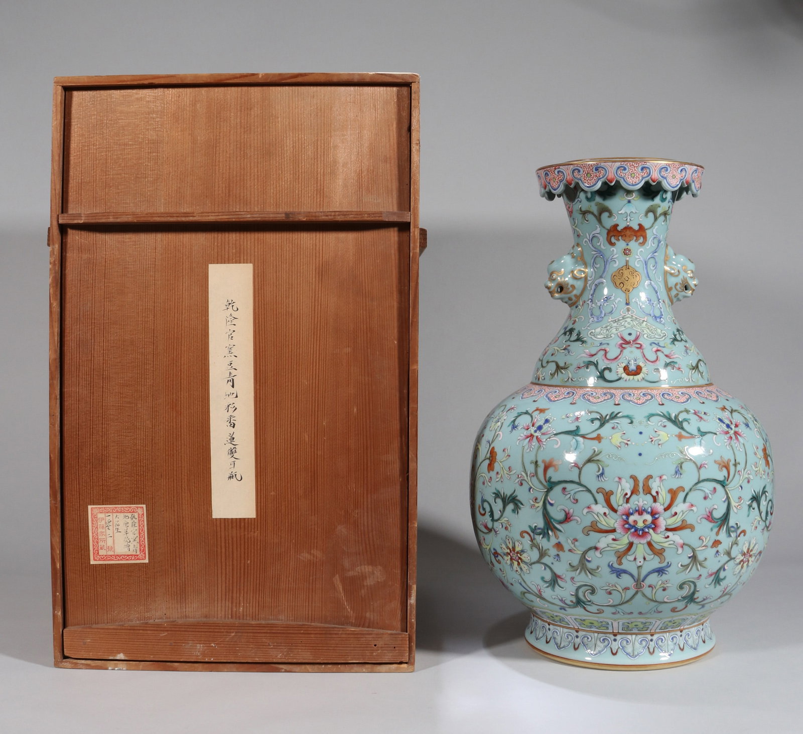 A TURQUOISE-GROUND YANGCAI 'FLORAL' LARGE ZUN WITH DOUBLE BEAST HANDLES: A turquoise-ground yangcai large zun decorated with floral designs and set with double beast-form handles. Height 47 cm. Note: By repute, from the Ito family collection.