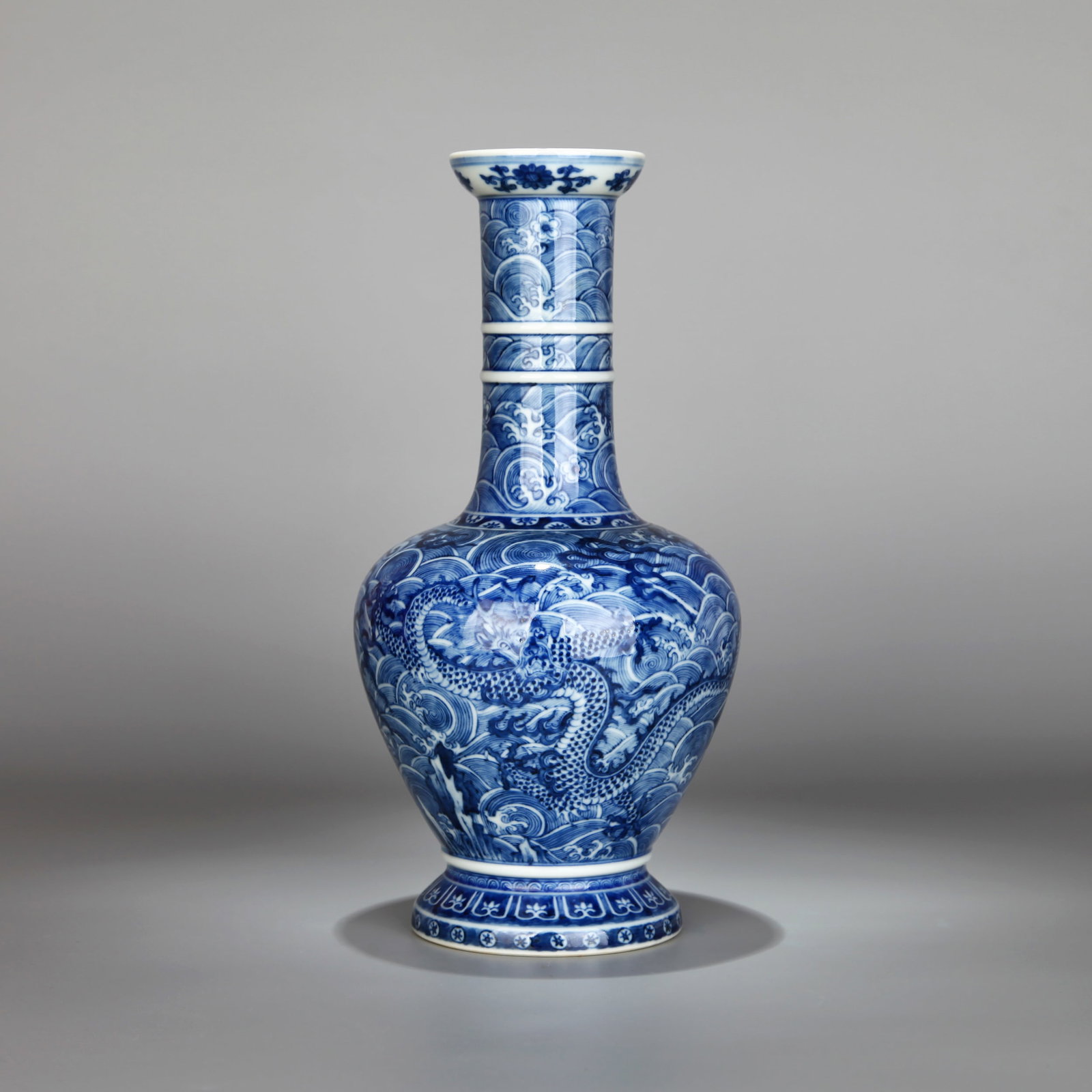 A BLUE-AND-WHITE 'DRAGON AMID WAVES' SHANGPING VASE: A blue-and-white Shangping vase decorated with a dragon amid waves. Height 38 cm.