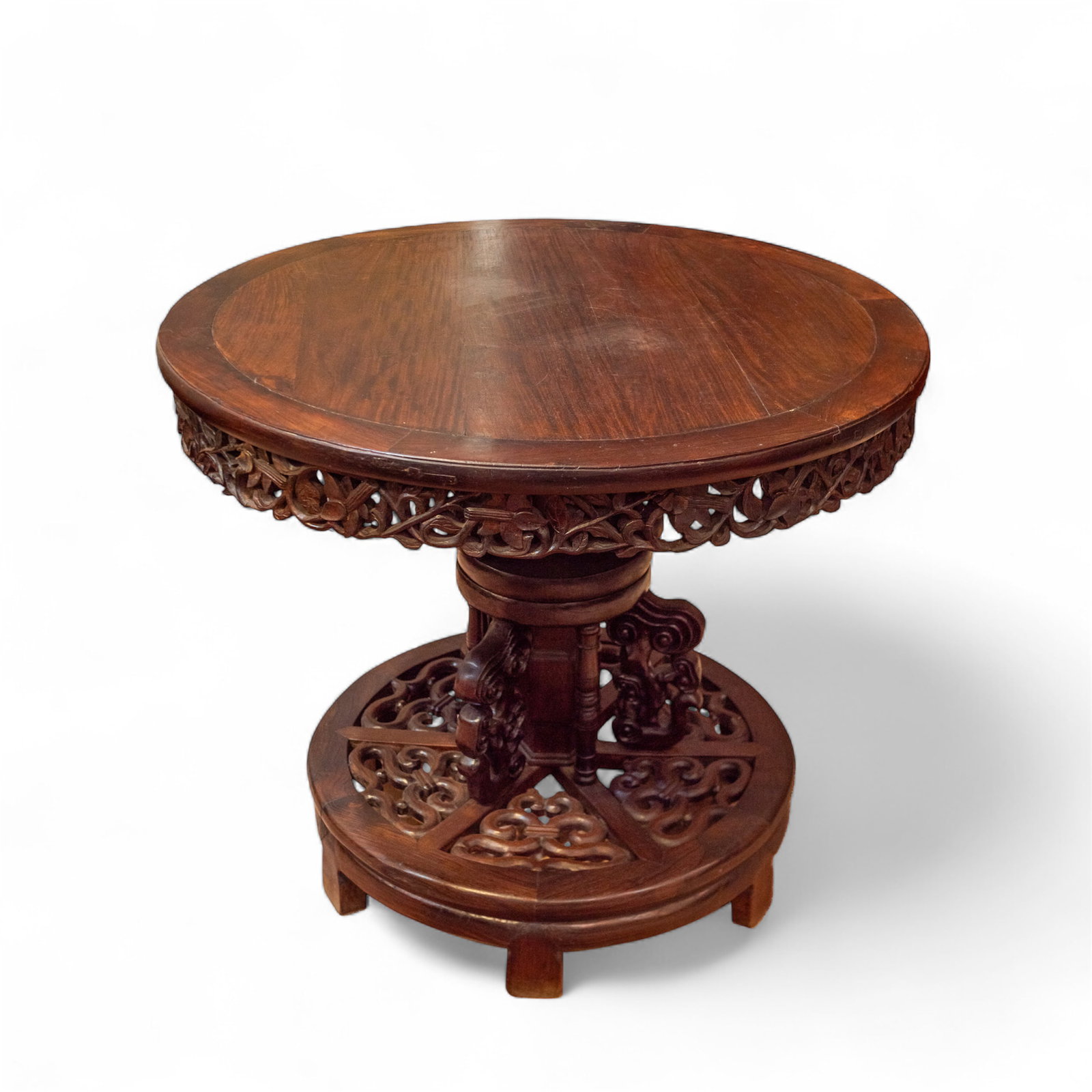 CHINESE ROSEWOOD AND HONGMU ROUND TABLE, QING DYNASTY: Chinese rosewood and hongmu round table, Qing dynasty, with a circular top and openwork apron, on a circular base. 32.28"h x 37.4"d (82 x 95 cm) Provenance: Estate in Southern California.
